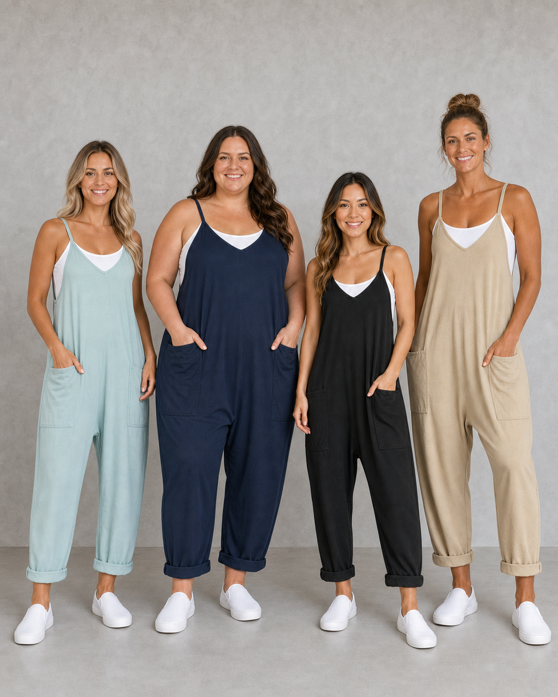 Four women wearing dusty mint navy black and warm sand jumpsuits