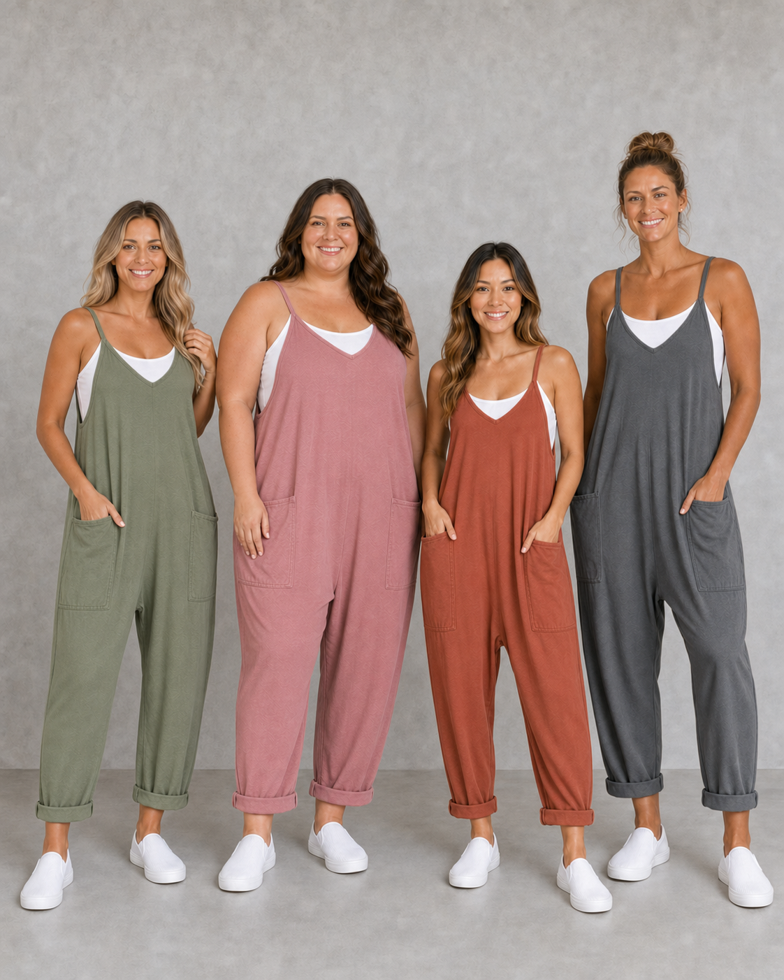 Four women wearing sage rose terracotta and charcoal jumpsuits