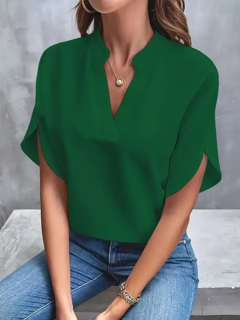 Blusa verde esmeralda de mujer con cuello abierto y mangas tulipán