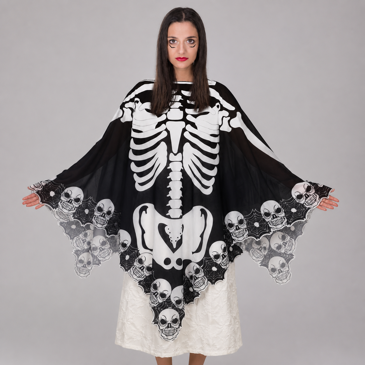 Cape poncho squelette noire et blanche pour Halloween
