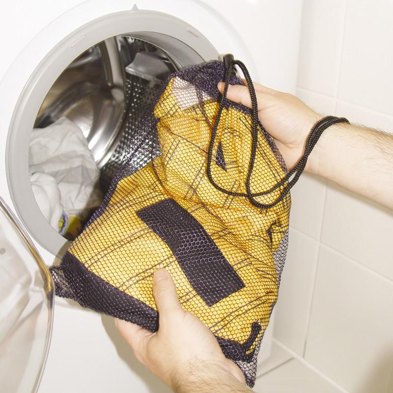 Football jersey turned inside out in a mesh laundry bag