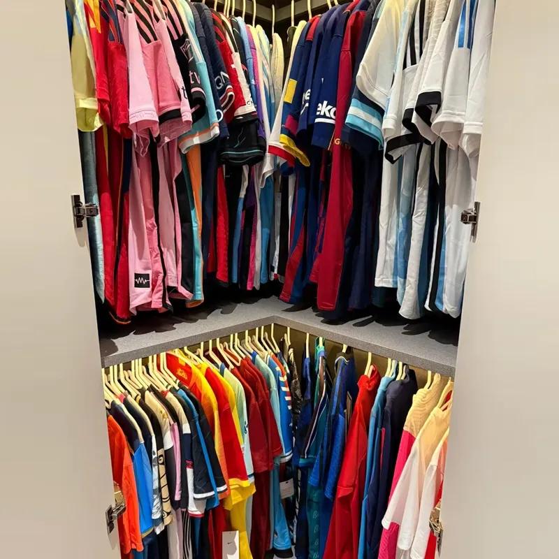 Football jerseys stored and hanging neatly in a cool ventilated wardrobe