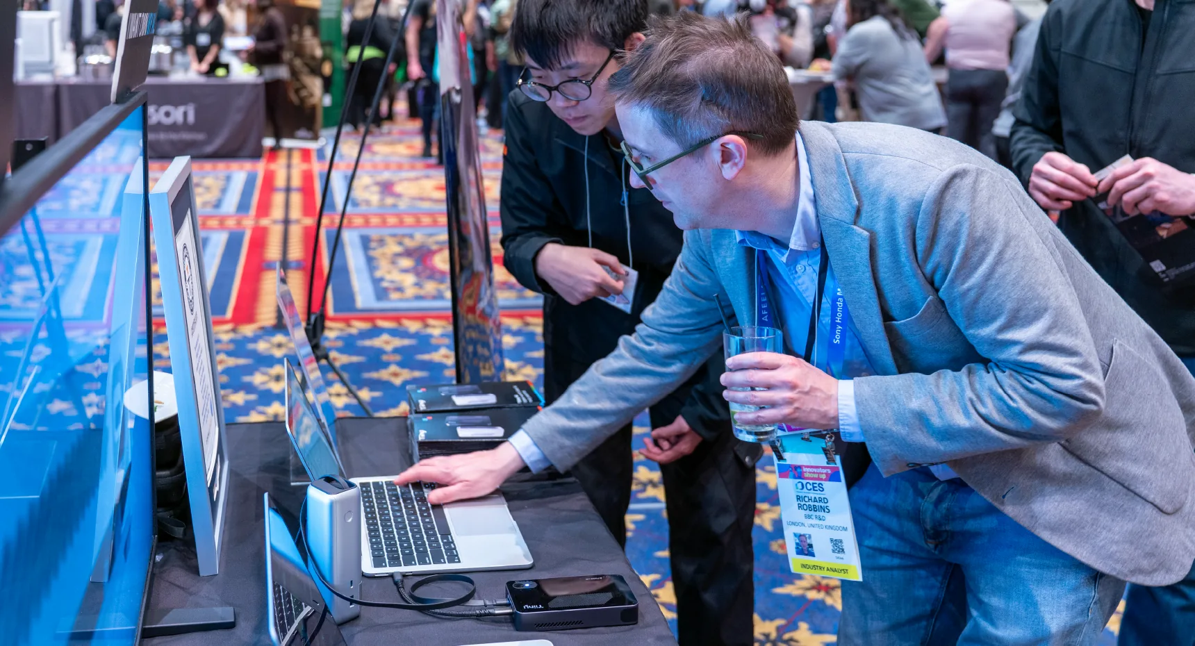 A visitor trying a Tiiny Pocket demonstration at CES