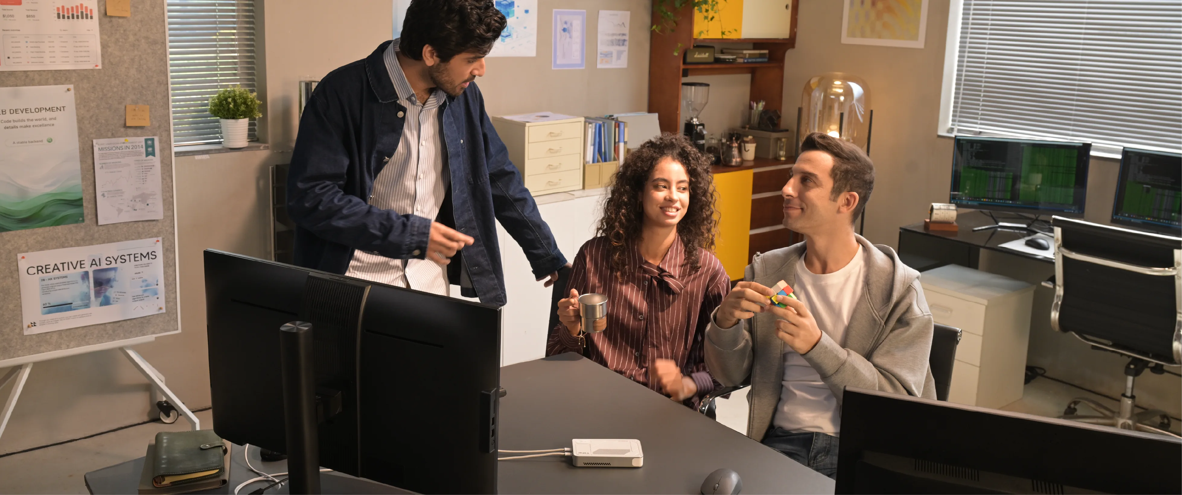 Tiiny team members discussing ideas together in their office