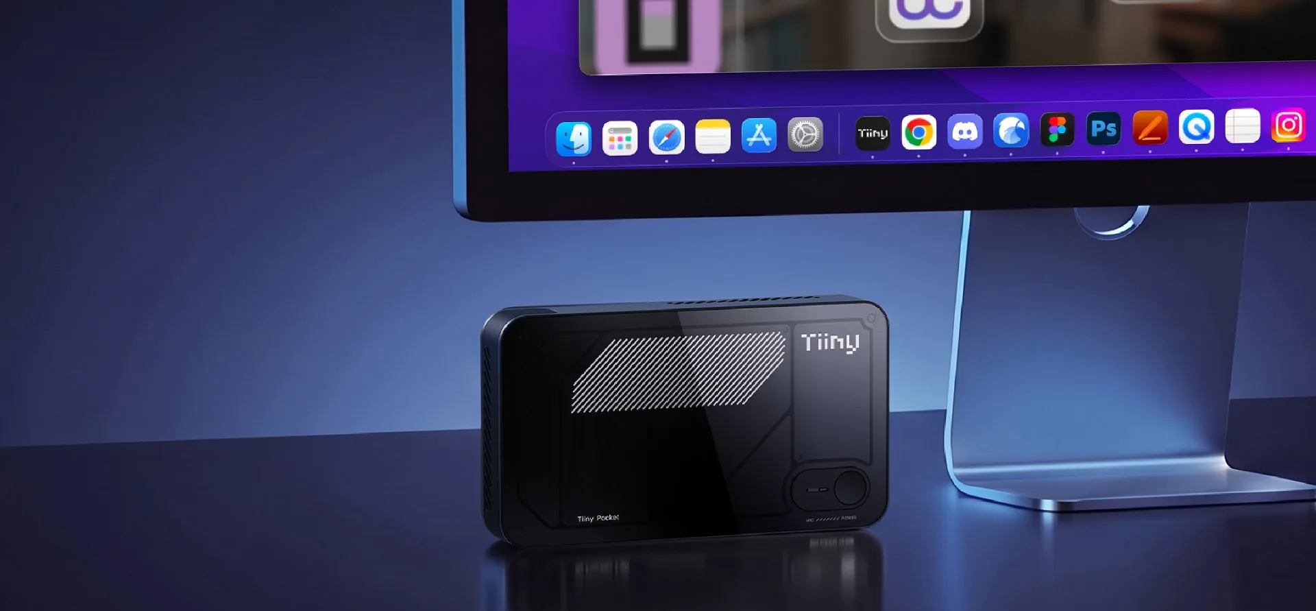 Tiiny AI Pocket beside a desktop computer