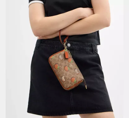 Nolita 19 In Signature Canvas With Orange Print