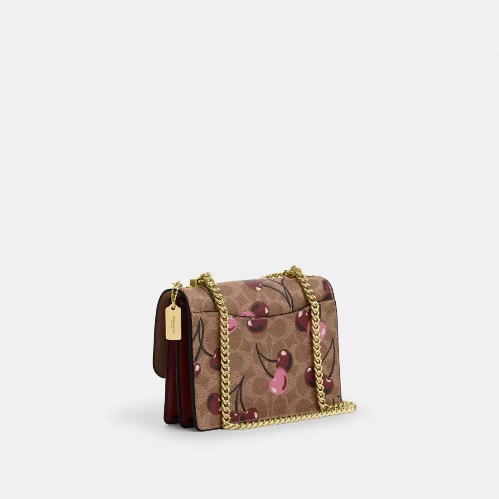 Mini Klare Crossbody Bag In Signature Canvas With Cherry Print