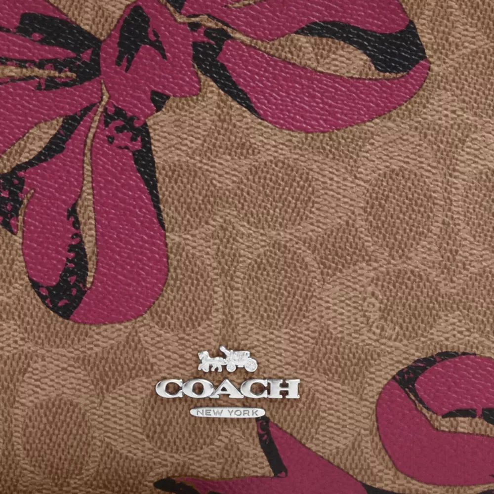 Slim Crossbody Bag In Signature Canvas With Bow Print