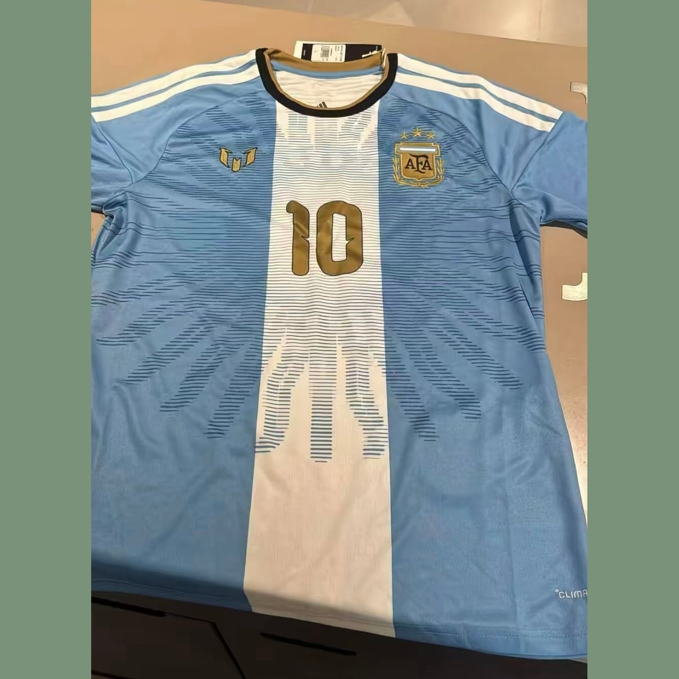2026 Argentina Messi farewell special edition shirt, flat lay with the gold 10