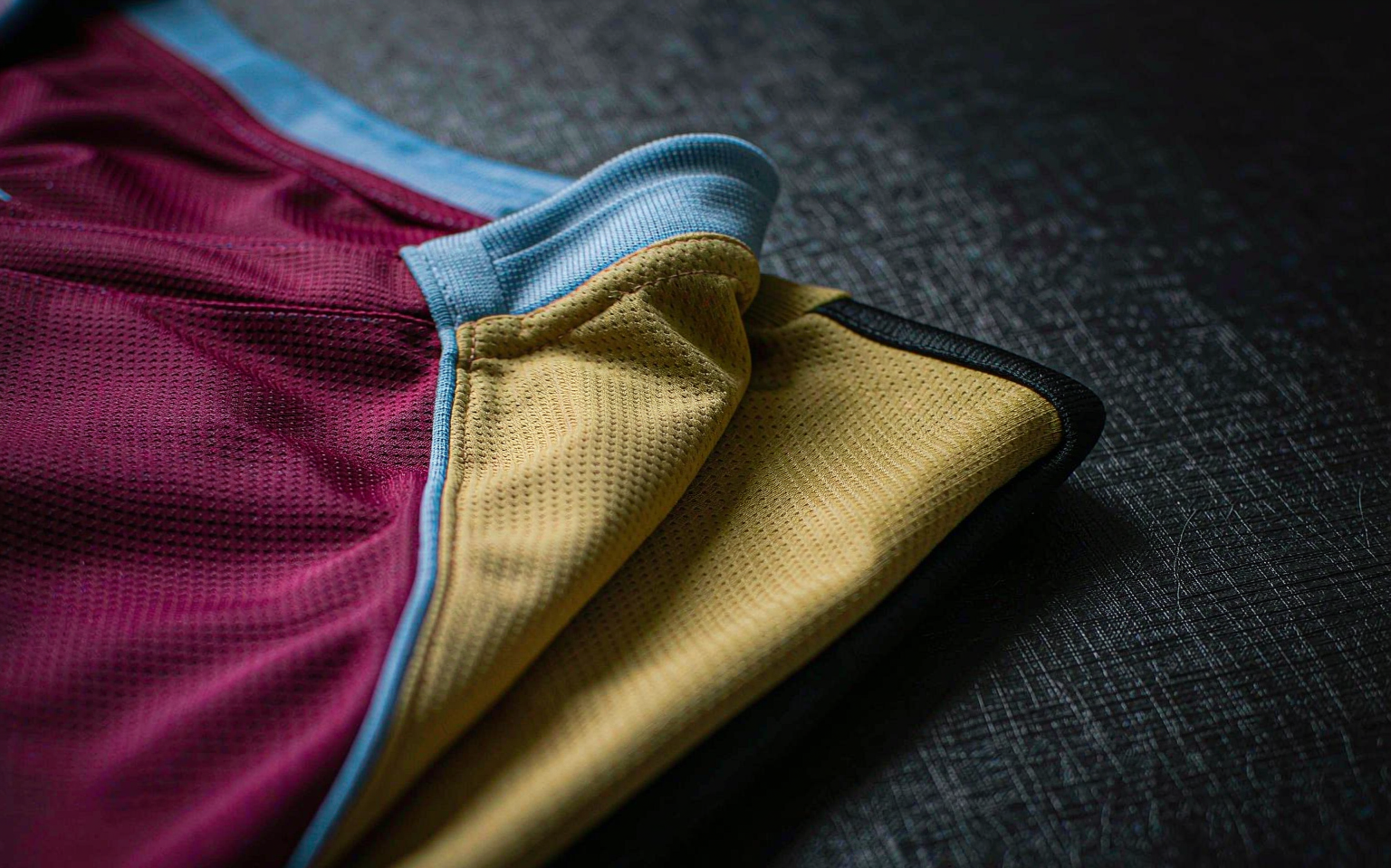Close-up of claret and old-gold jersey fabric