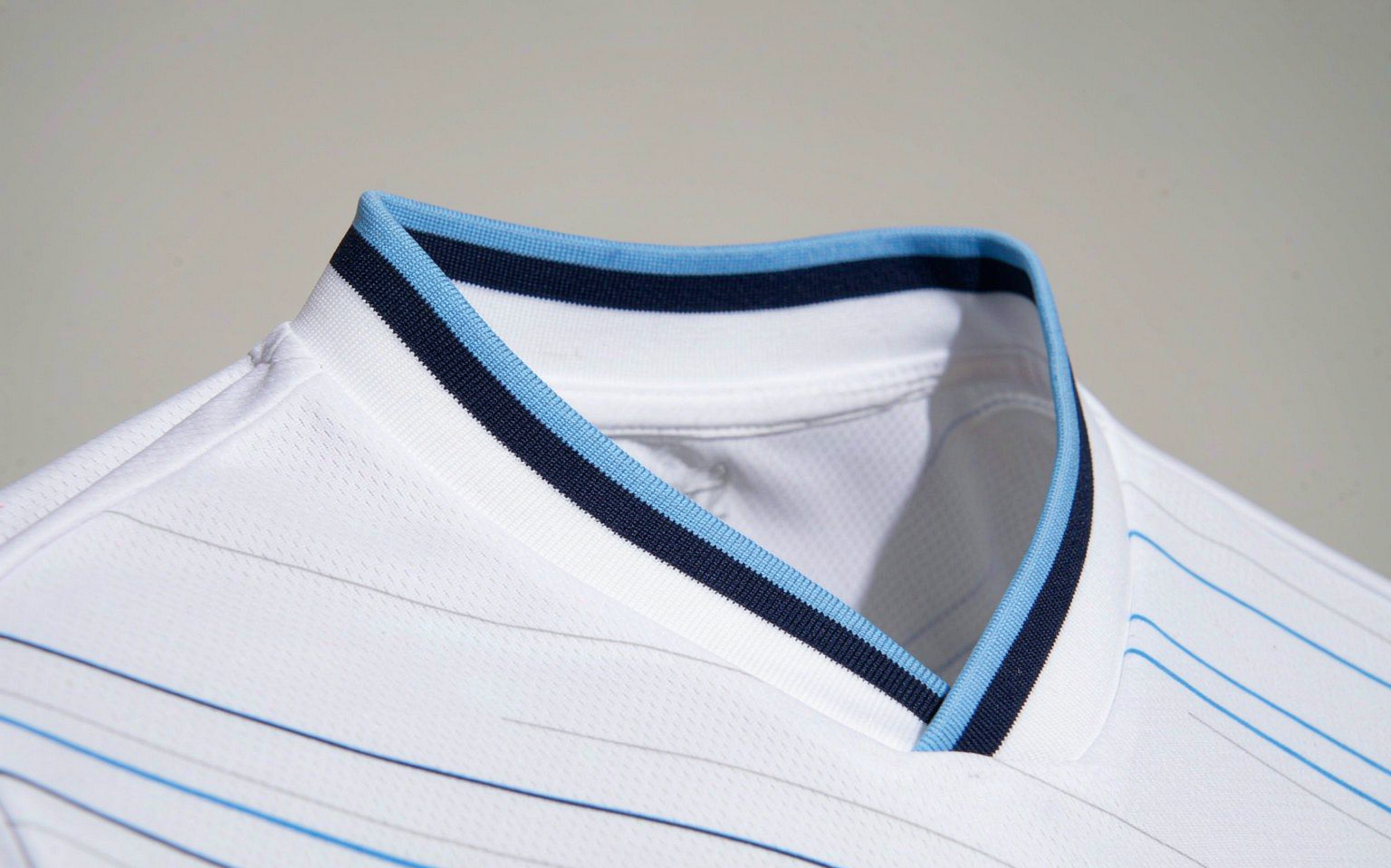 Close-up of football shirt fabric showing weave and collar detail