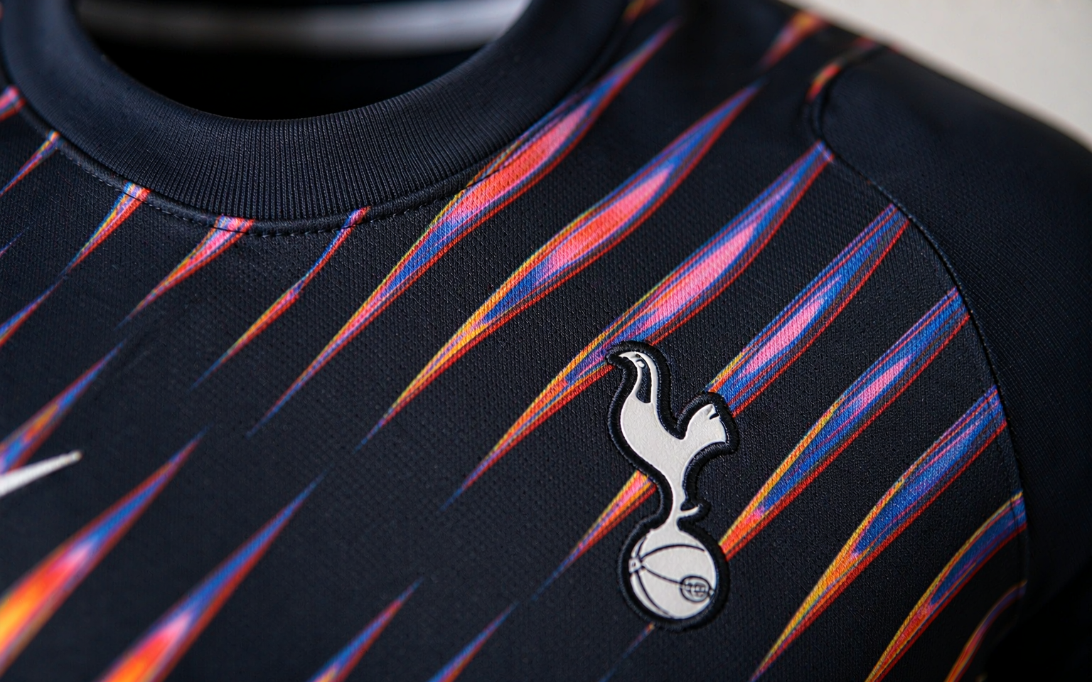 Close-up of football shirt fabric showing knit weave and collar stitching