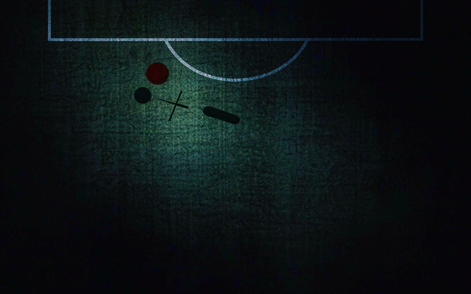 Overhead view of a dark football pitch with white line markings and red tactical markers