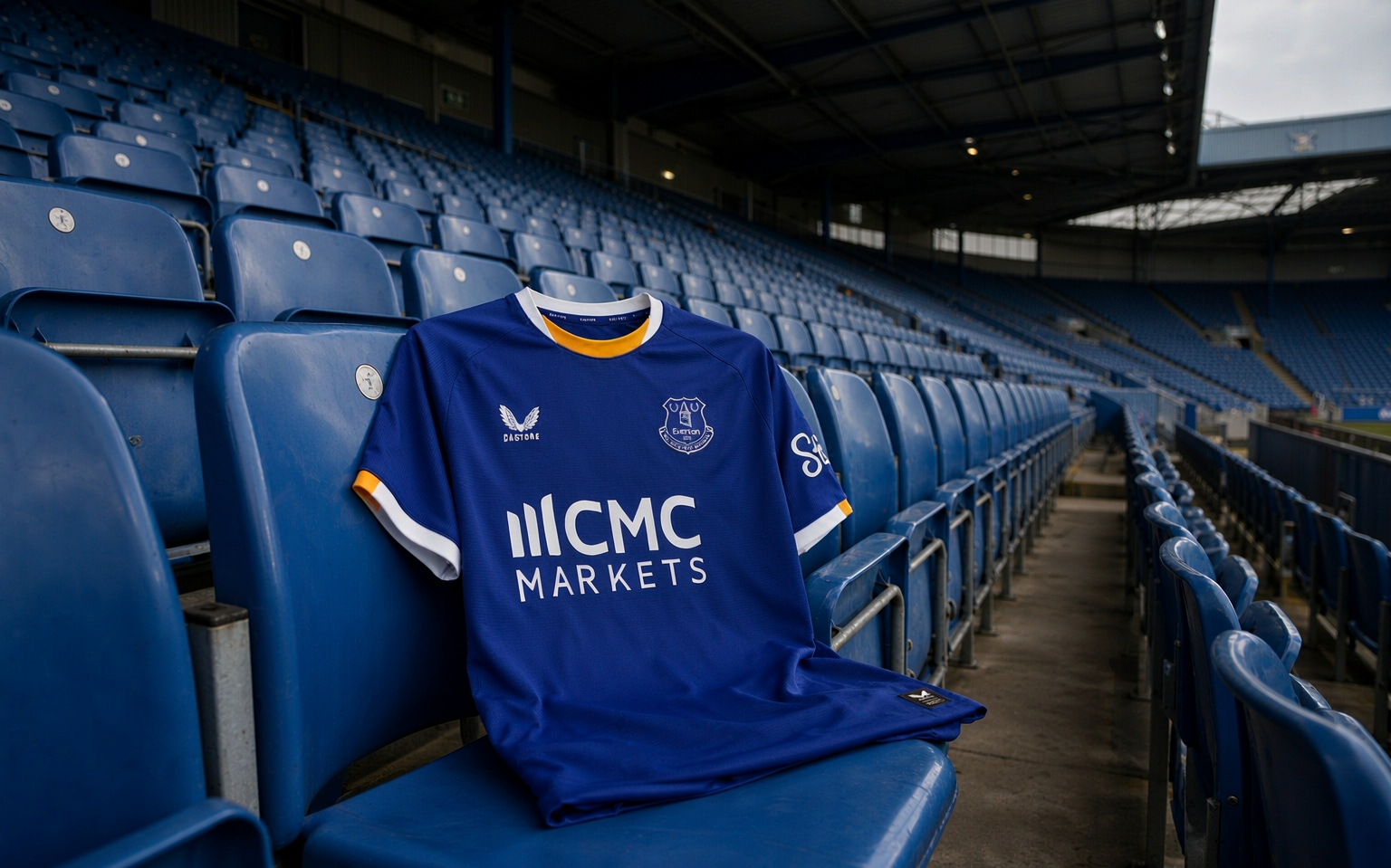 Empty football stadium stand at dusk with a folded shirt resting on a seat