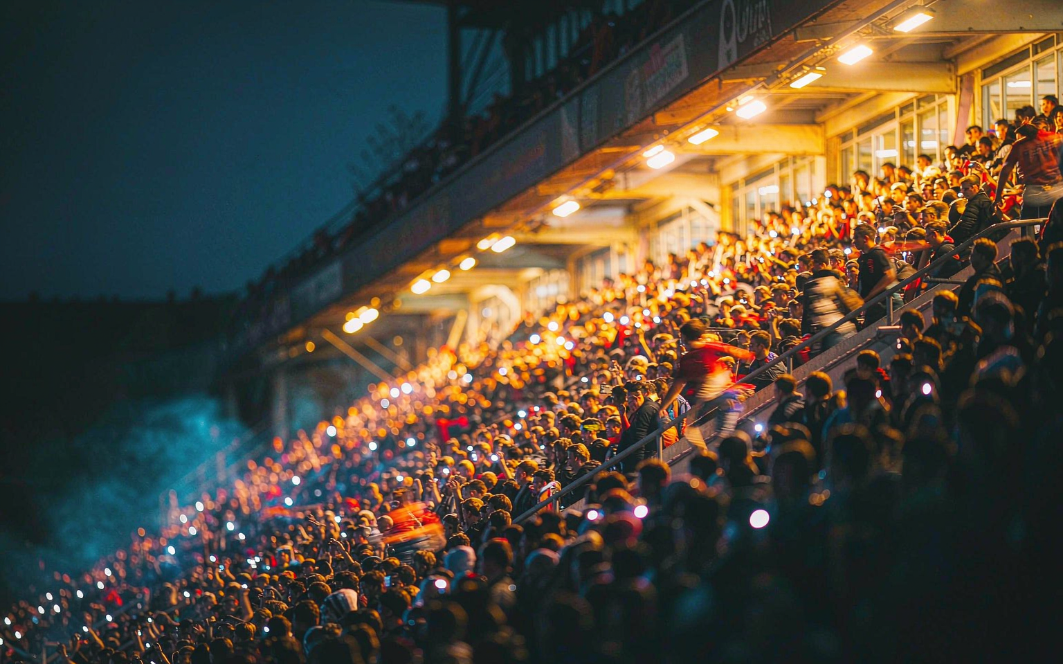 Floodlit stadium stand on a midweek matchnight