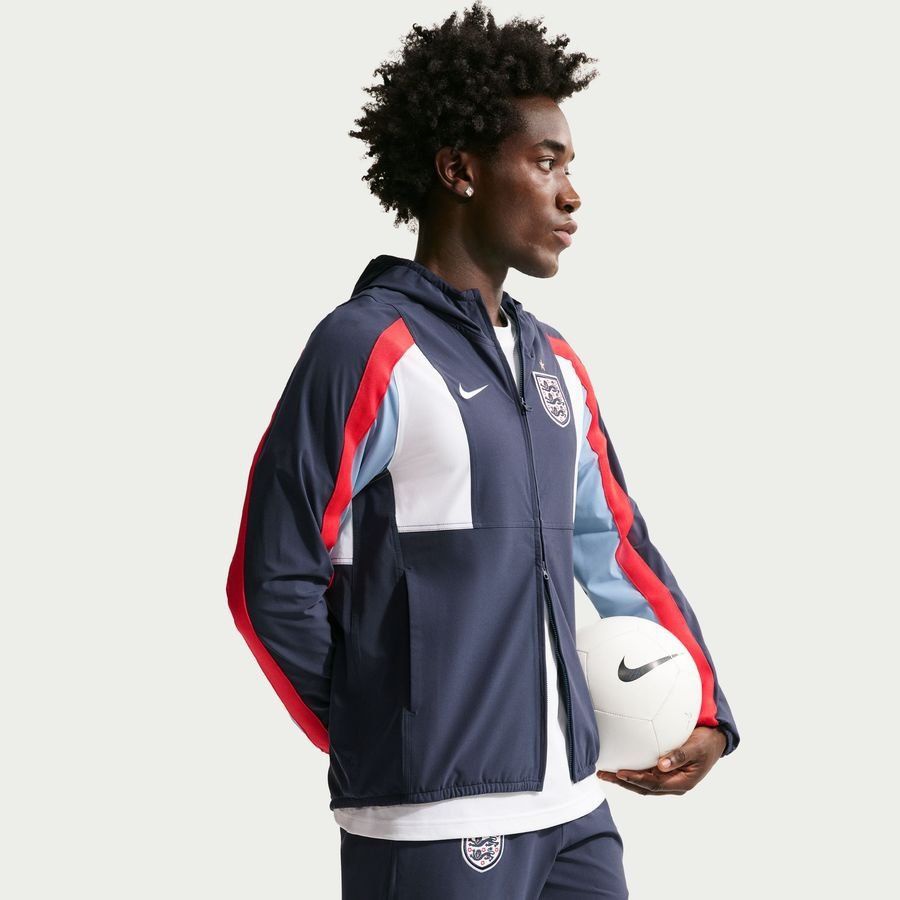 England Track Top Dri-FIT Energy Woven World Cup 2026 - Obsidian/Work Blue/Speed Red-League Fan Gear