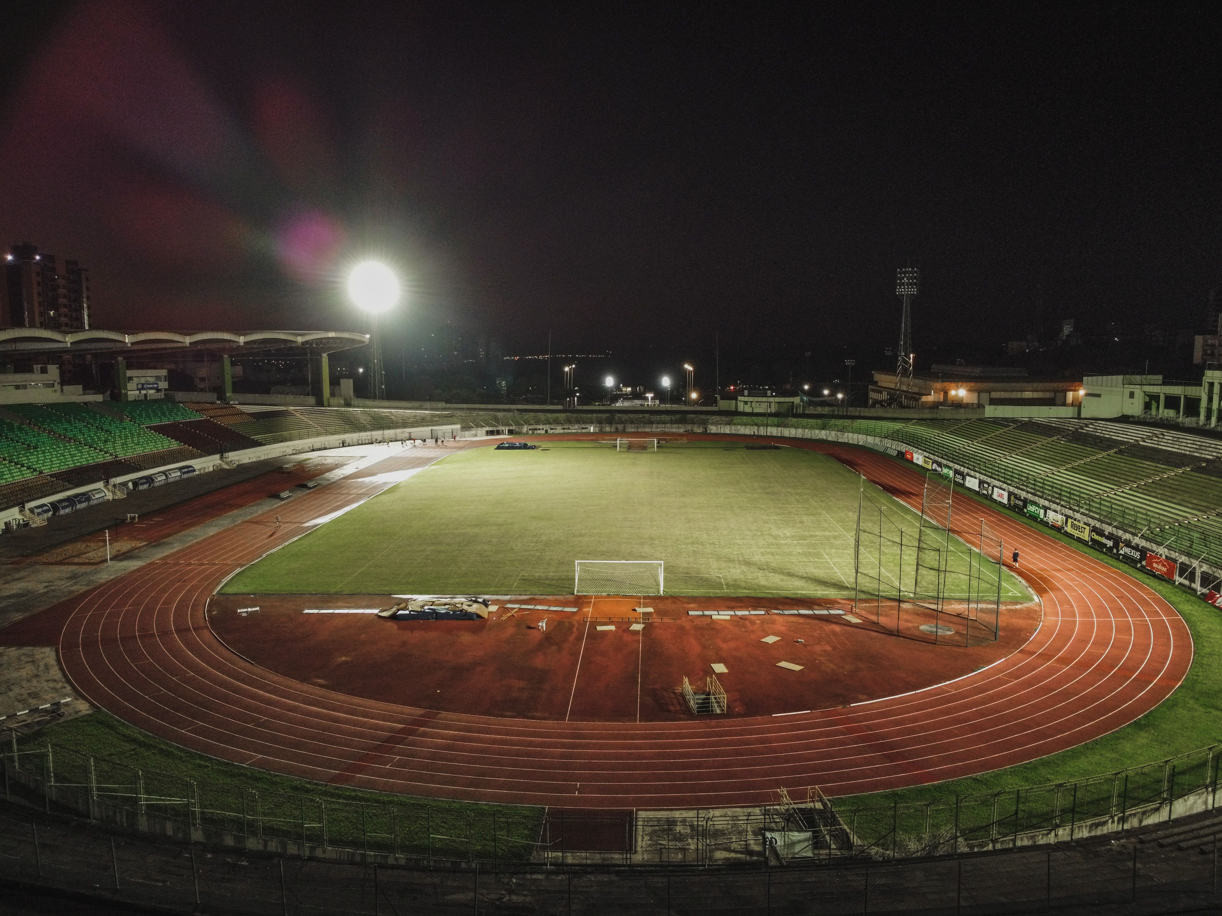 Aerial night view of an illuminated soccer stadium ready for the new season