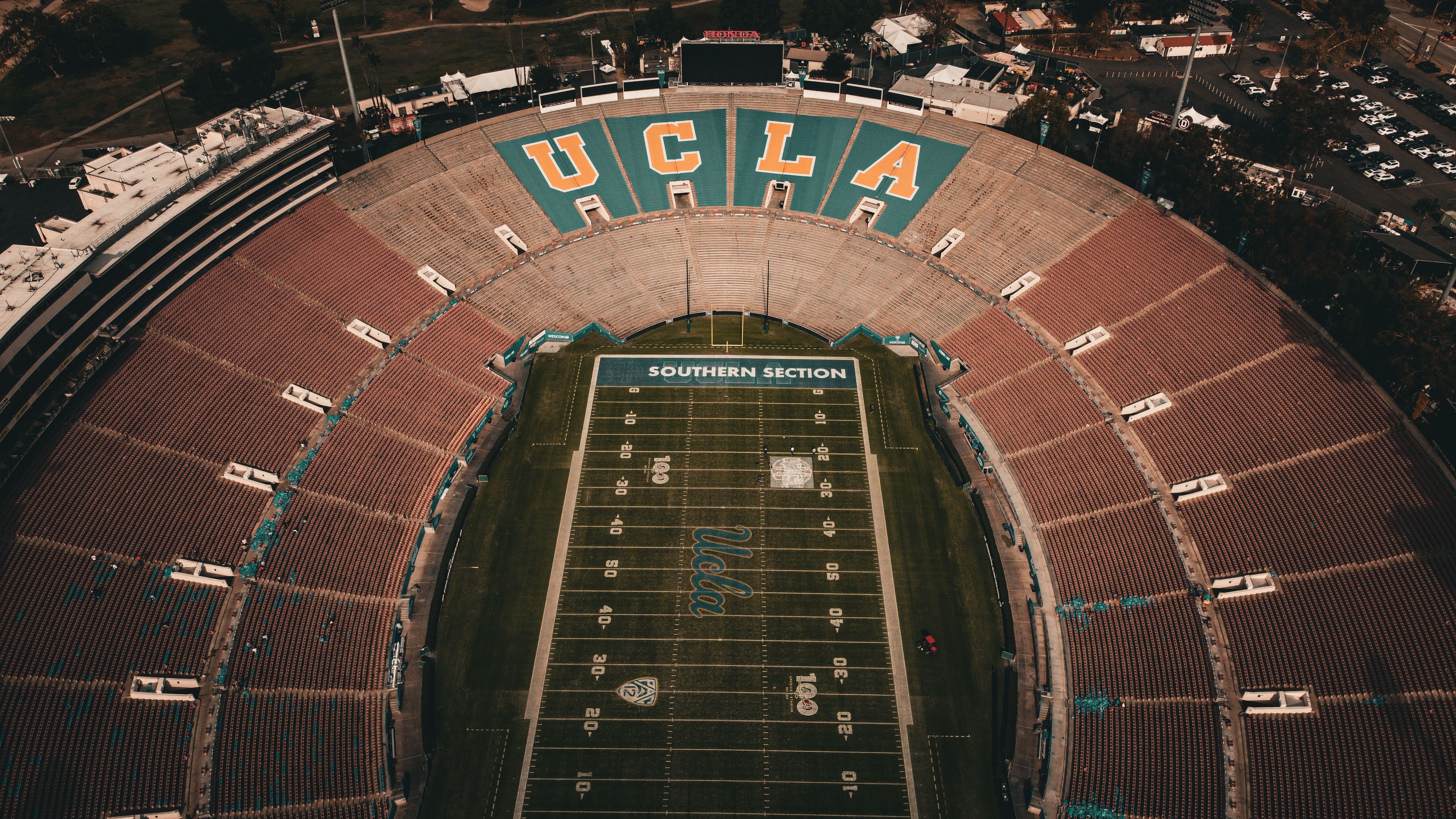 Aerial view of a college football stadium lit up for a night game