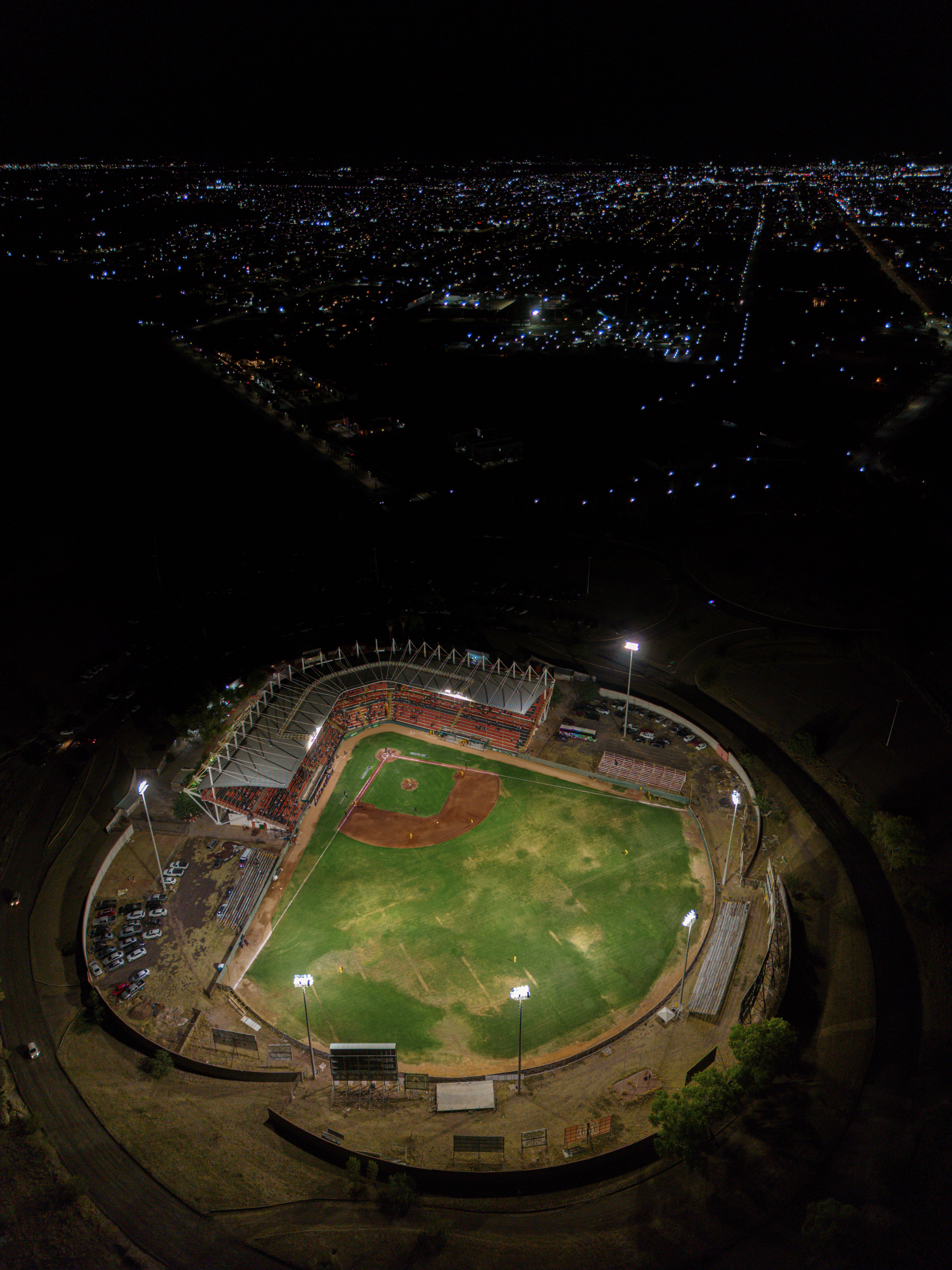 Aerial night view of a baseball stadium during a playoff push game