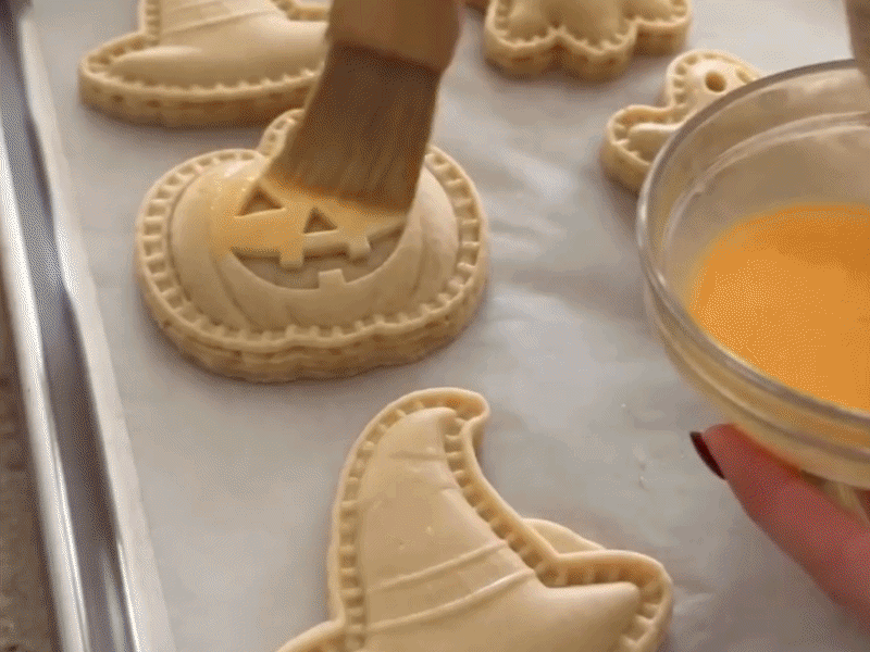 Suggested image: styled Halloween dessert table featuring mini pies made with molds