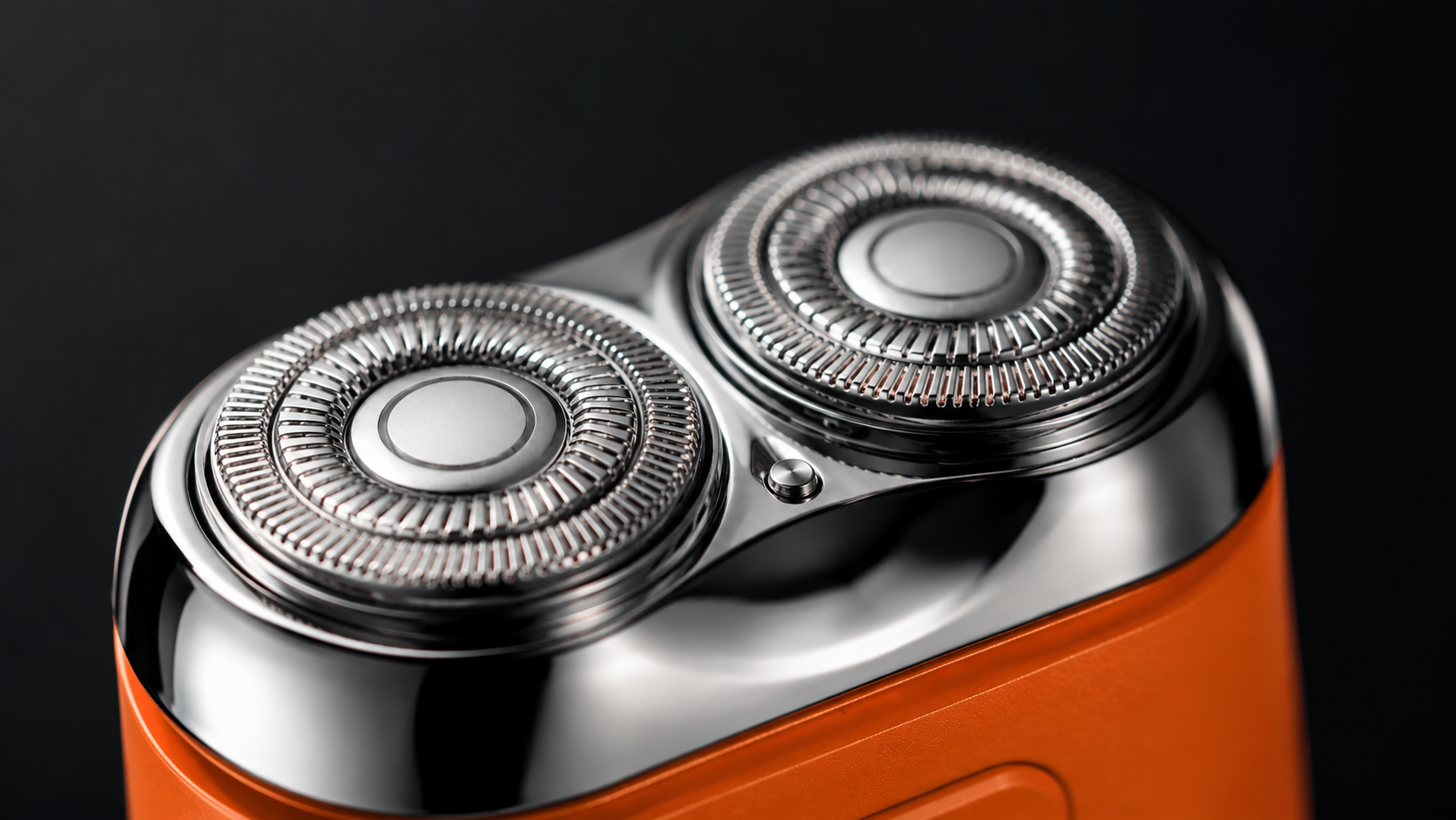 Suggested image: macro product photo of the two circular shaving heads and stainless-steel blade surfaces