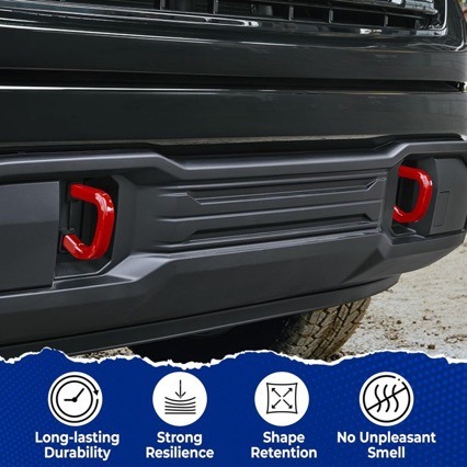 Red tow hook covers installed on truck front bumper