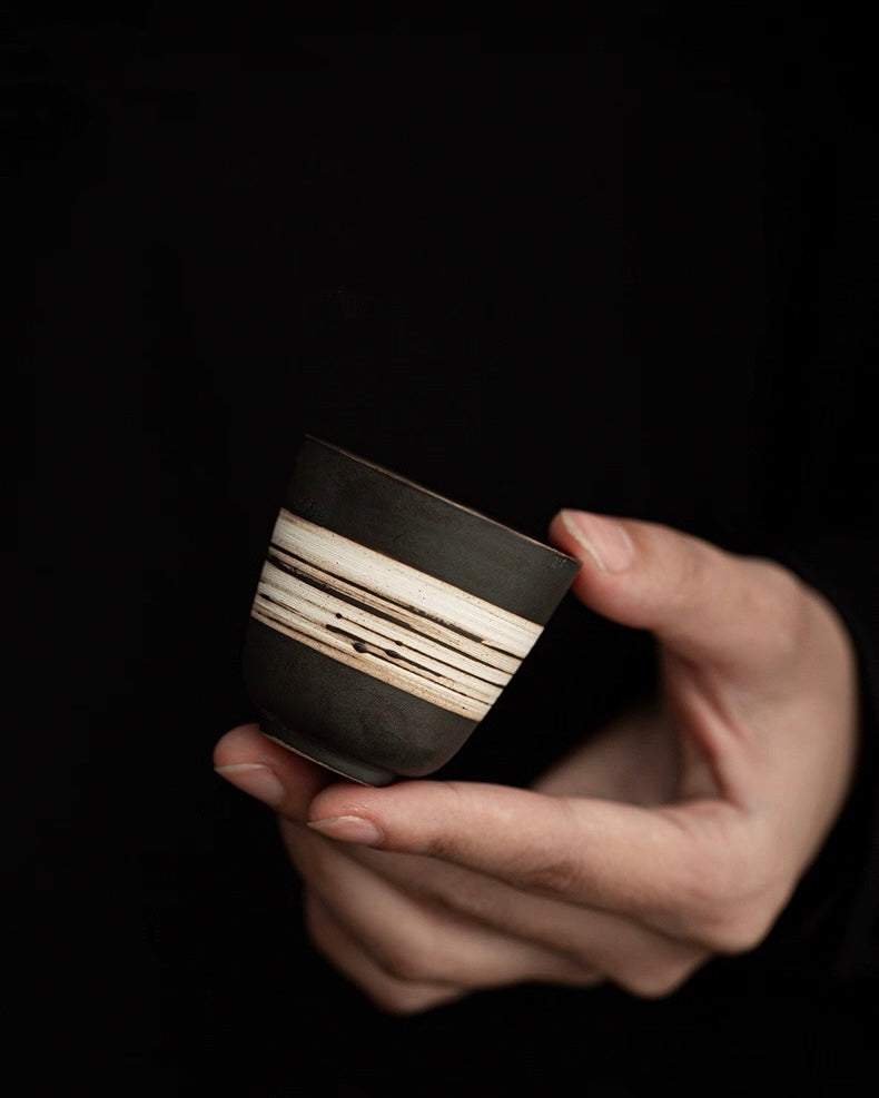 Minimalist rustic tea cup featuring wood-fired texture and raw clay surface, ideal for daily tea practice by Kungfuyang