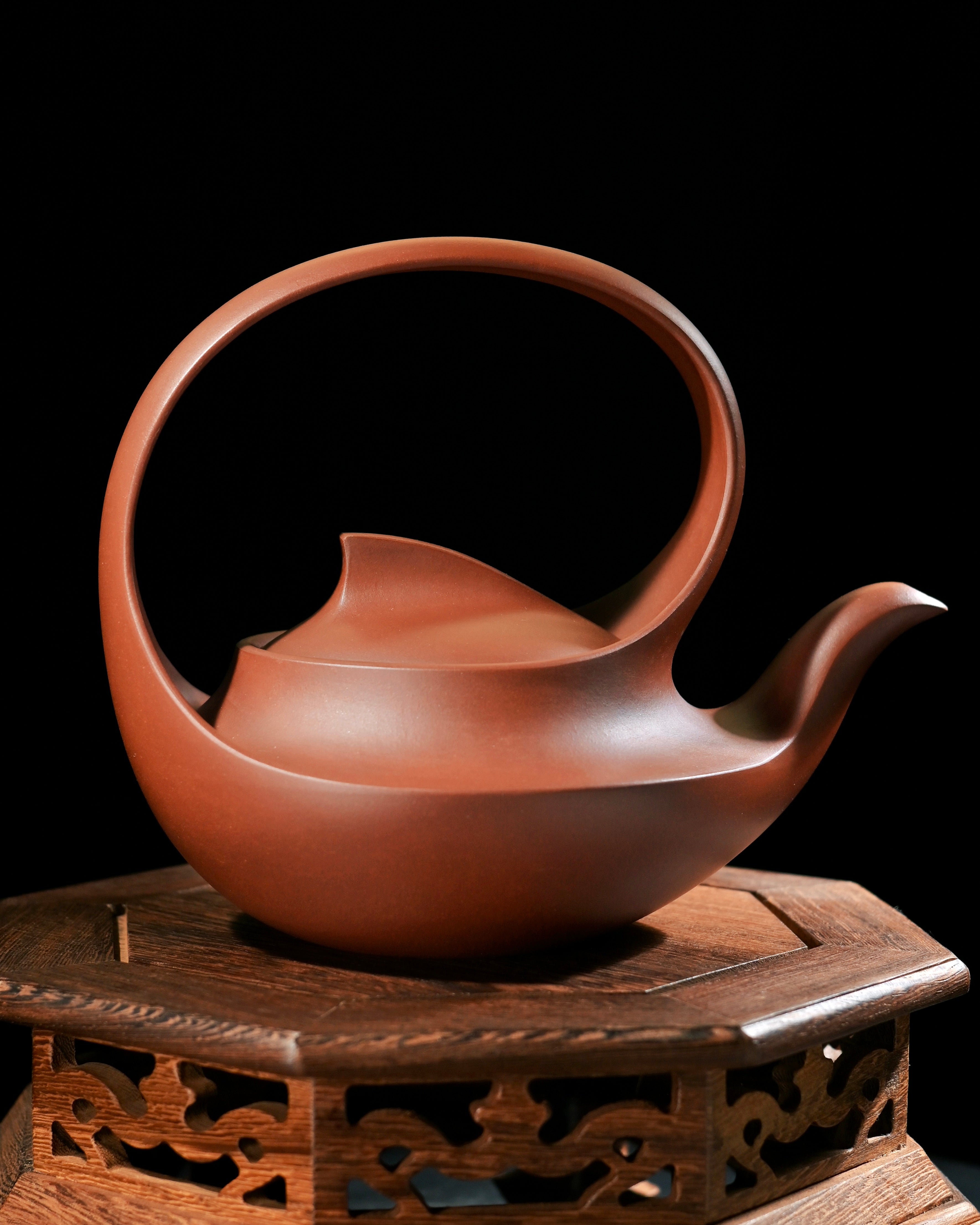 Snail-inspired Yixing teapot with continuous spiral formation, embodying traditional Chinese ceramic art and natural