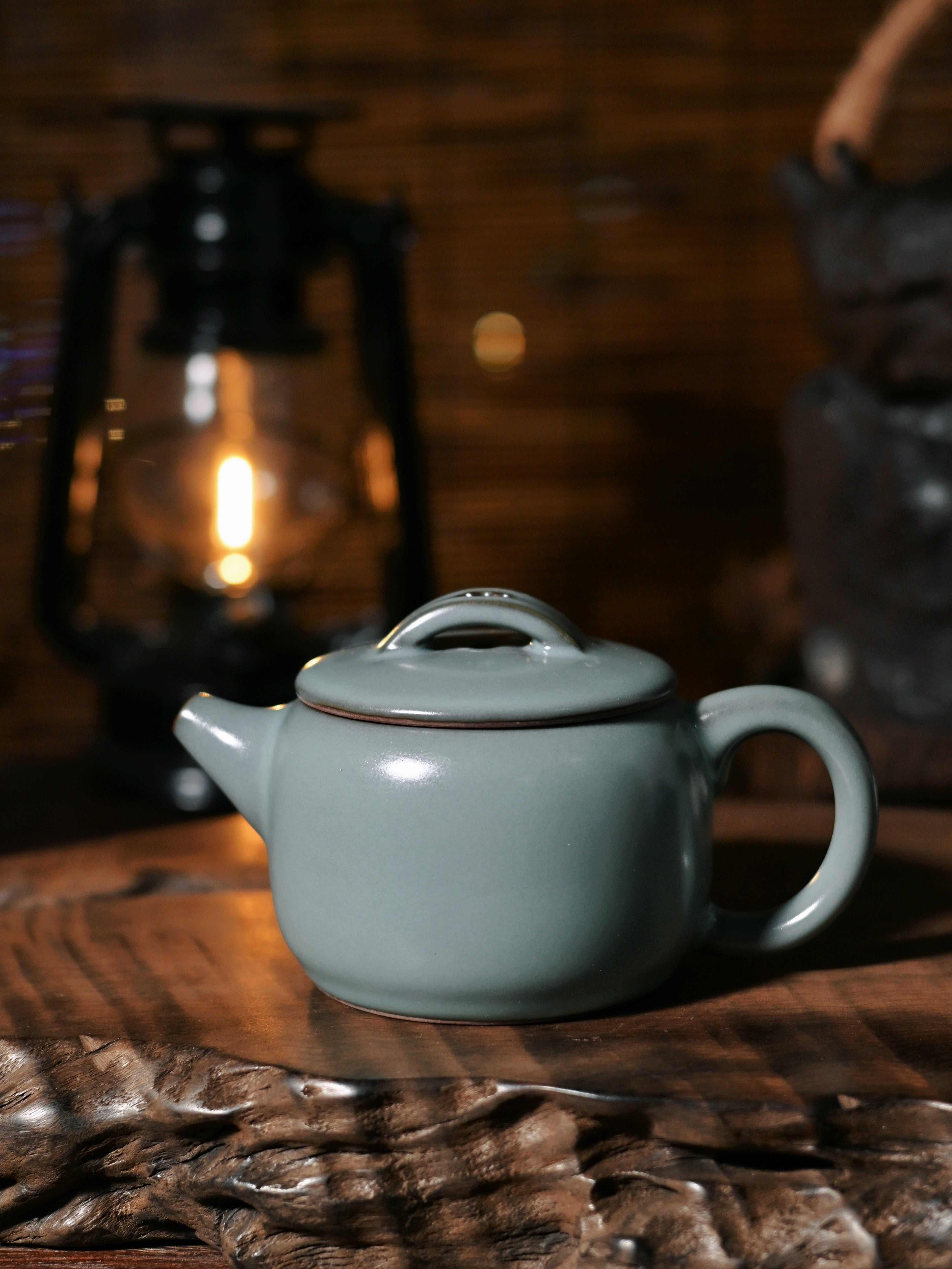 This Longquan Han-style teapot (280ml) features a smooth jade-like glaze, wide mouth form, and balanced pouring. A calm