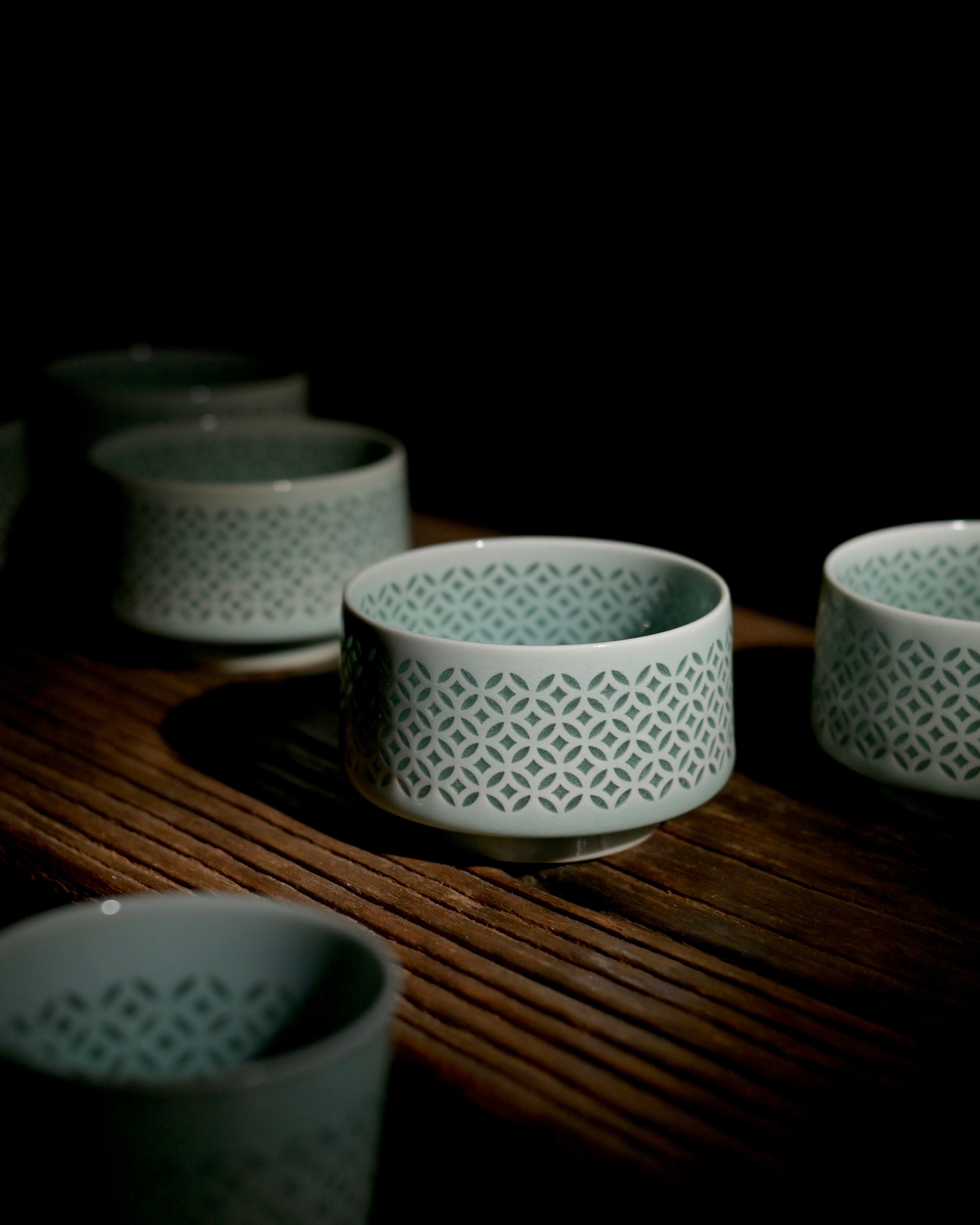 Food safe lead-free high firing linglong Longquan celadon tea mug, hand perforated lattice jade glaze single serving tea cup