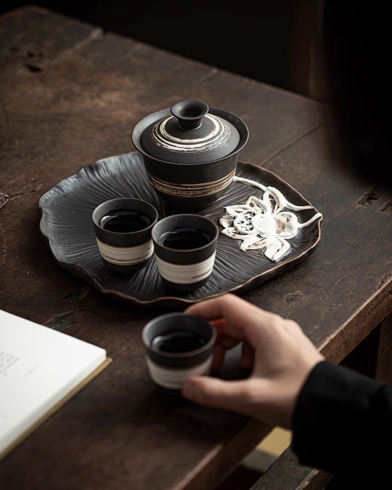 Minimalist wabi-sabi tea ware with coarse texture, designed for meditative tea preparation rituals by Kungfuyang
