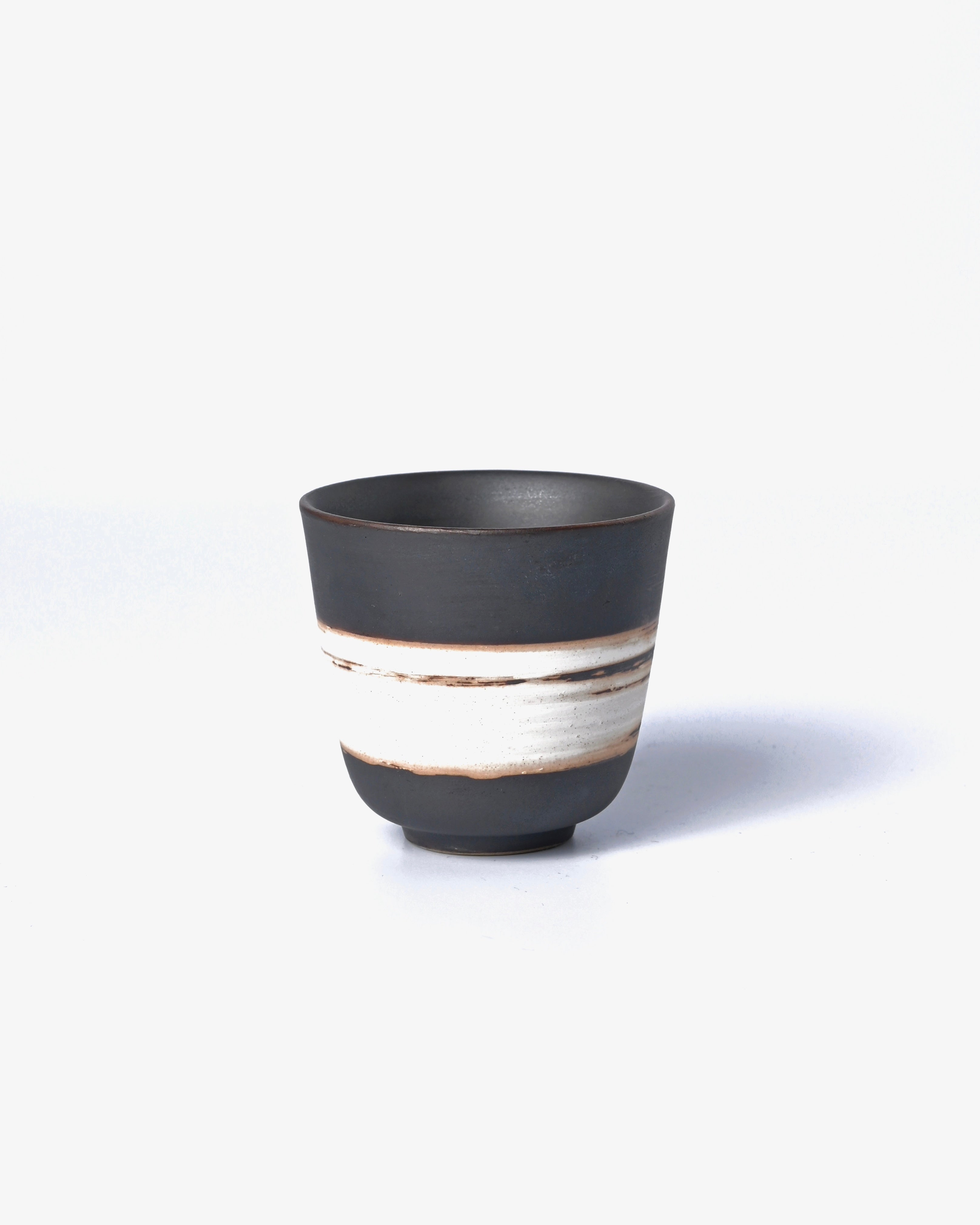 Wabi-sabi handmade tea cup with natural slip coating, perfect for mindful tea drinking and Zen ceremonies by Kungfuyang