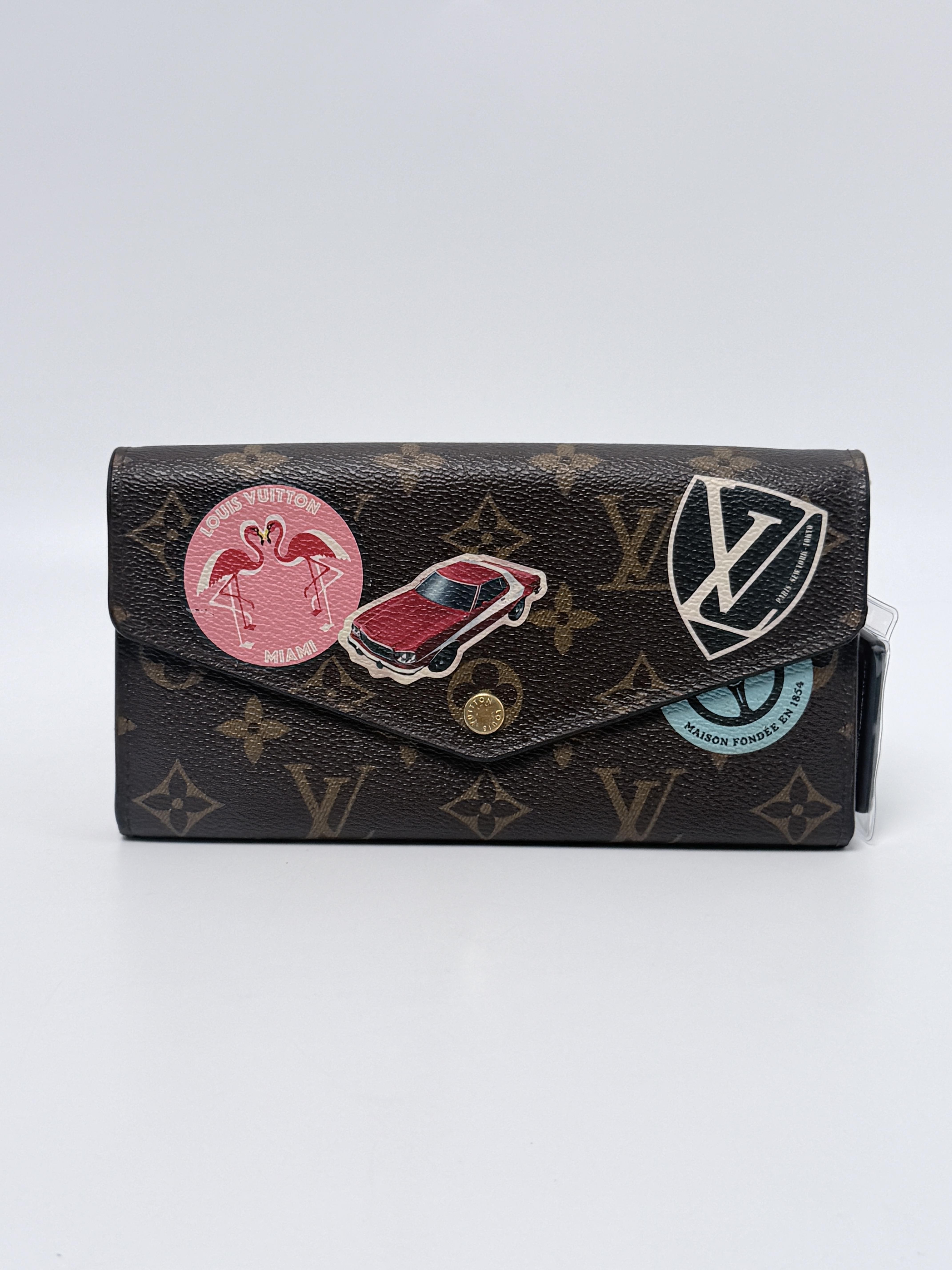 Limited Edition Monogram World Tour Patches Sarah Wallet JD1293LV