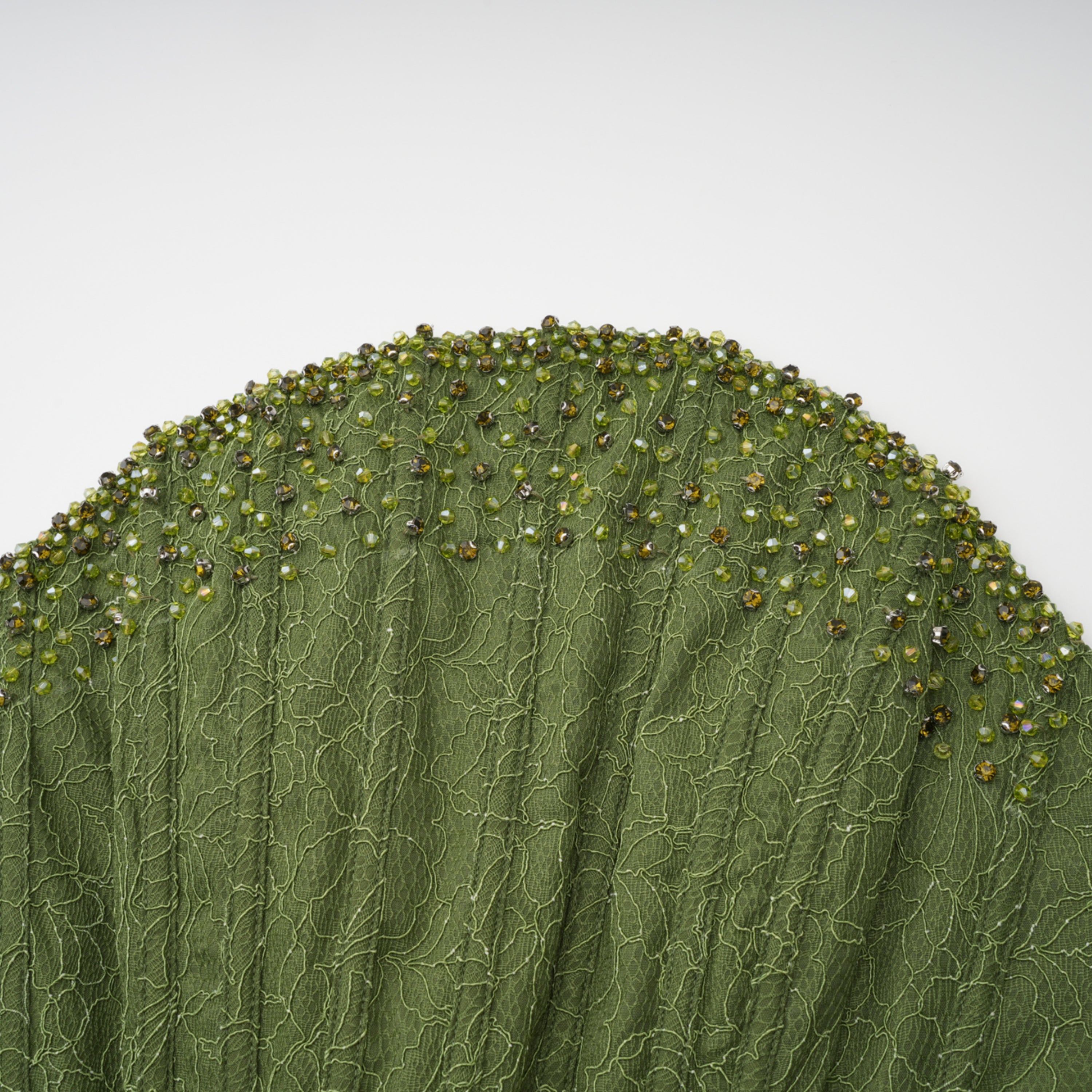 Sage green strapless maxi dress featuring a beaded neckline and draped corset bodice