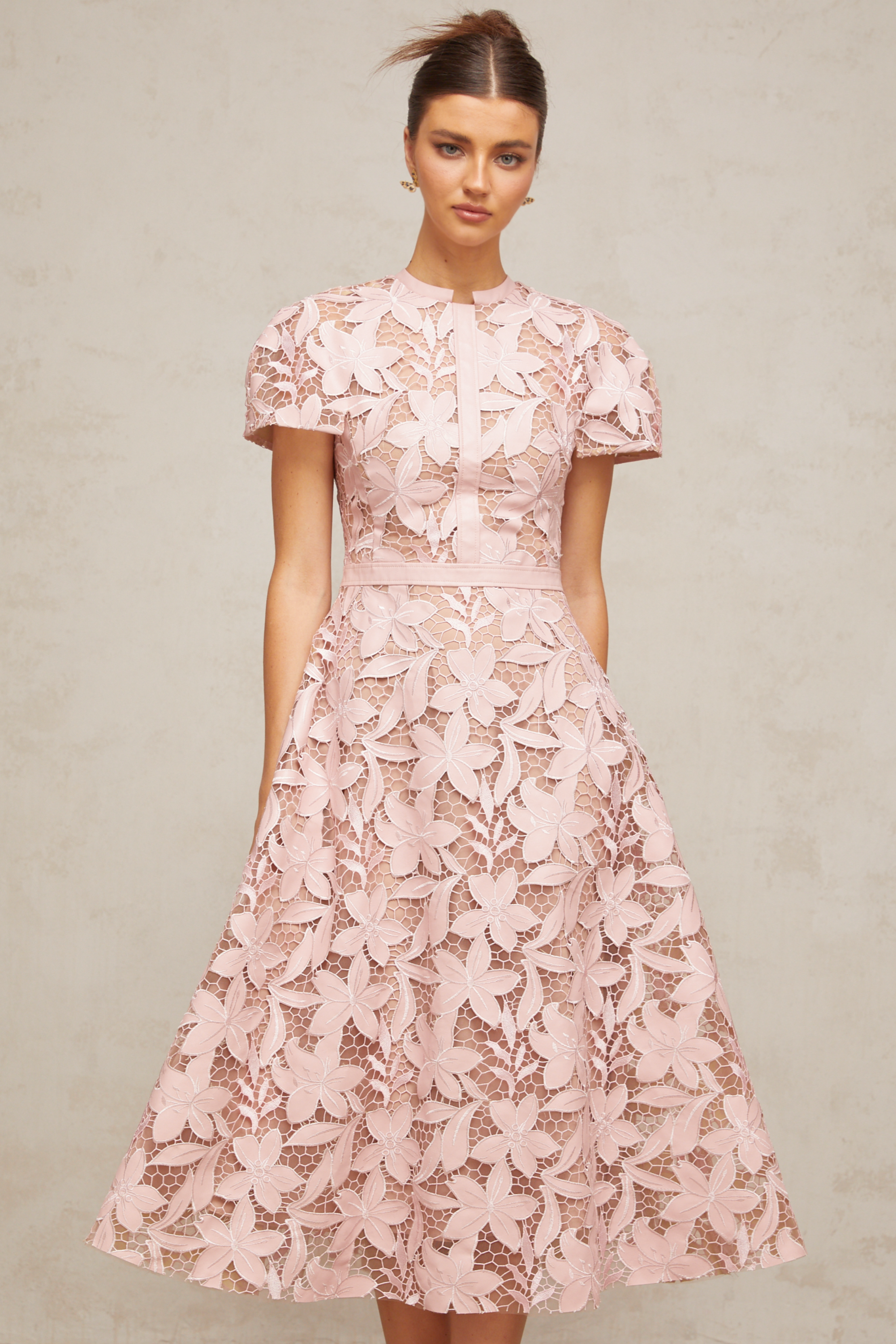 Pink floral laser-cut midi dress with short sleeves and a high neckline