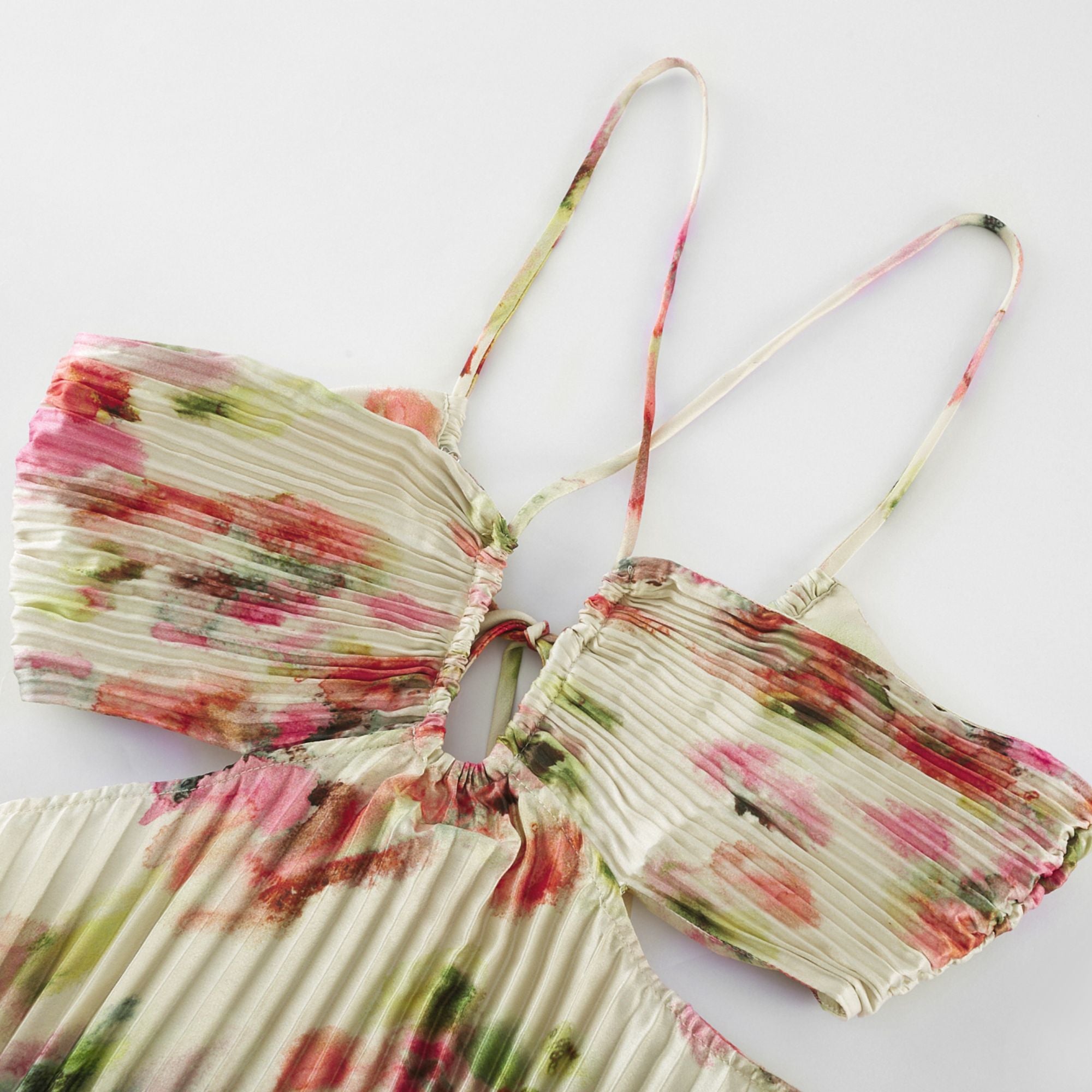 Floral pleated halter gown with side cutouts