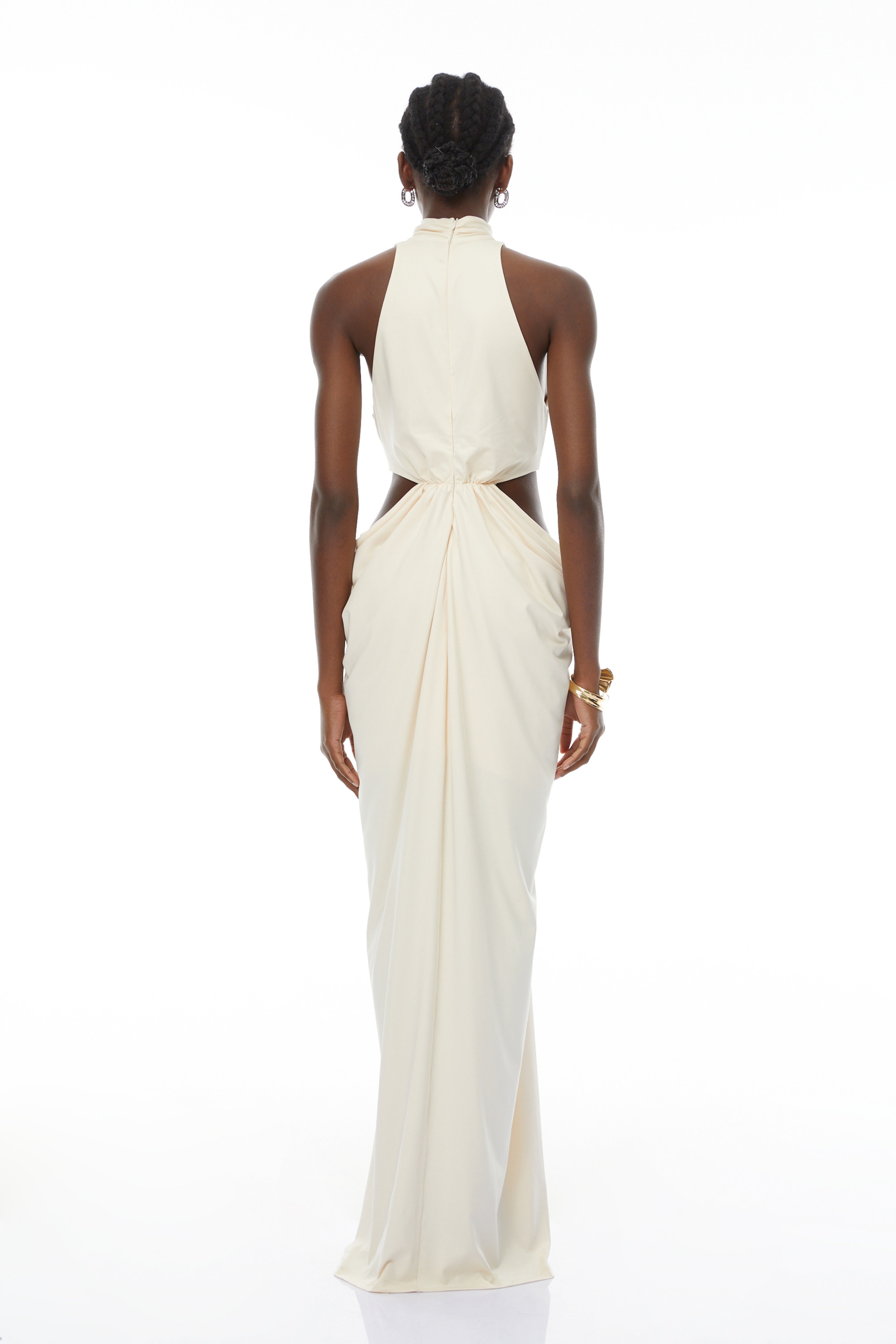 Cream halter maxi dress with waist cutouts and a knotted draped bodice
