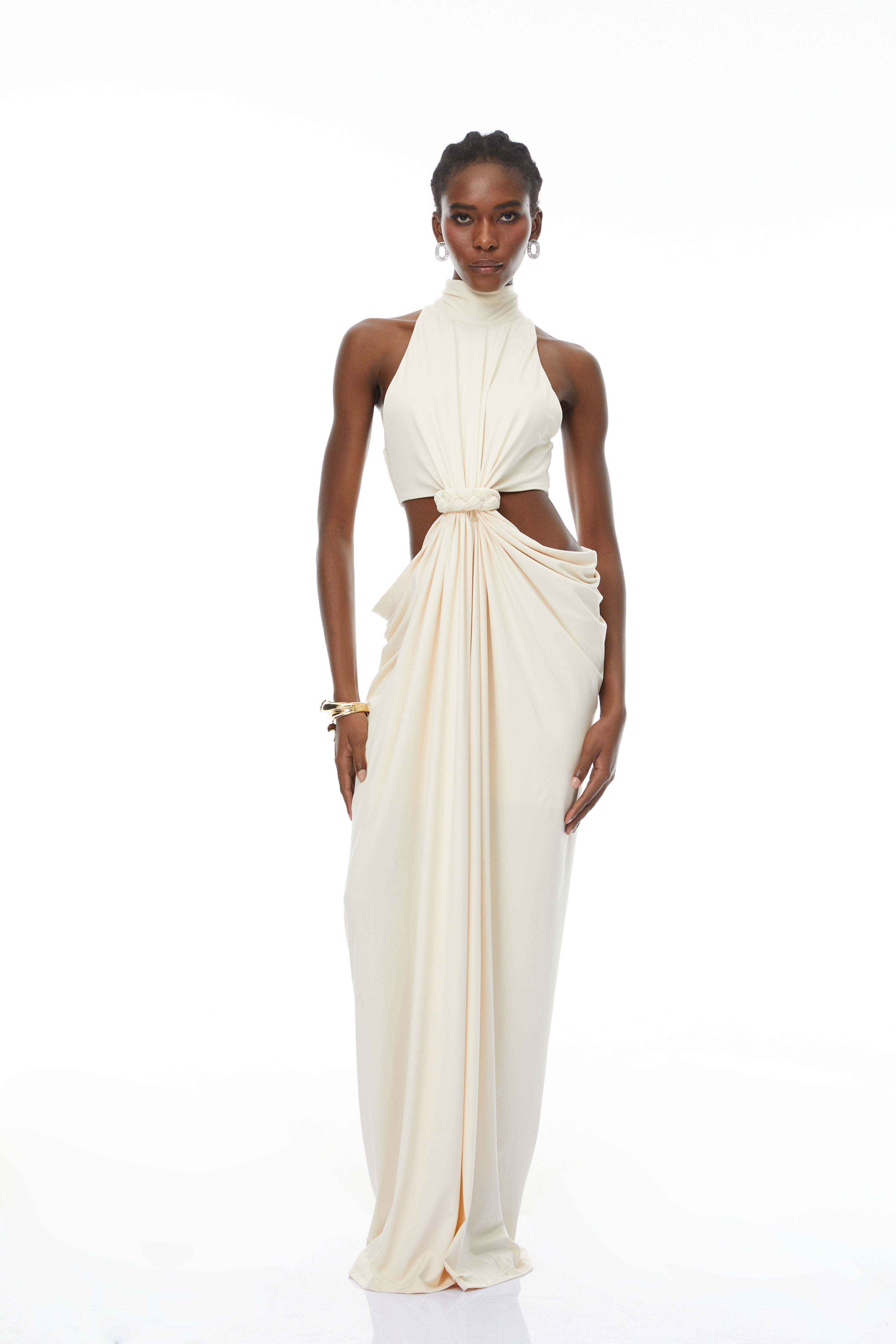 Cream halter maxi dress with waist cutouts and a knotted draped bodice