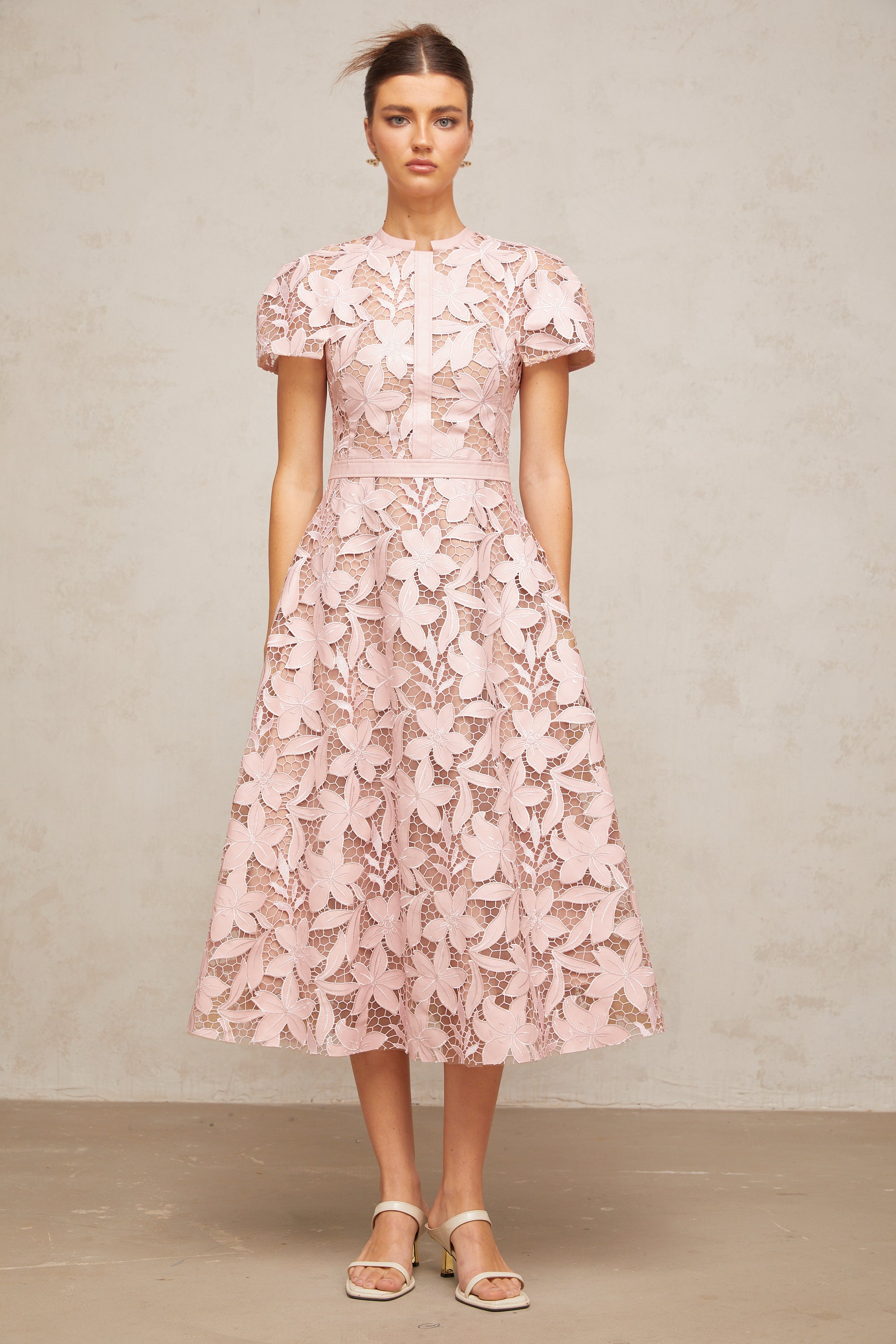 Pink floral laser-cut midi dress with short sleeves and a high neckline