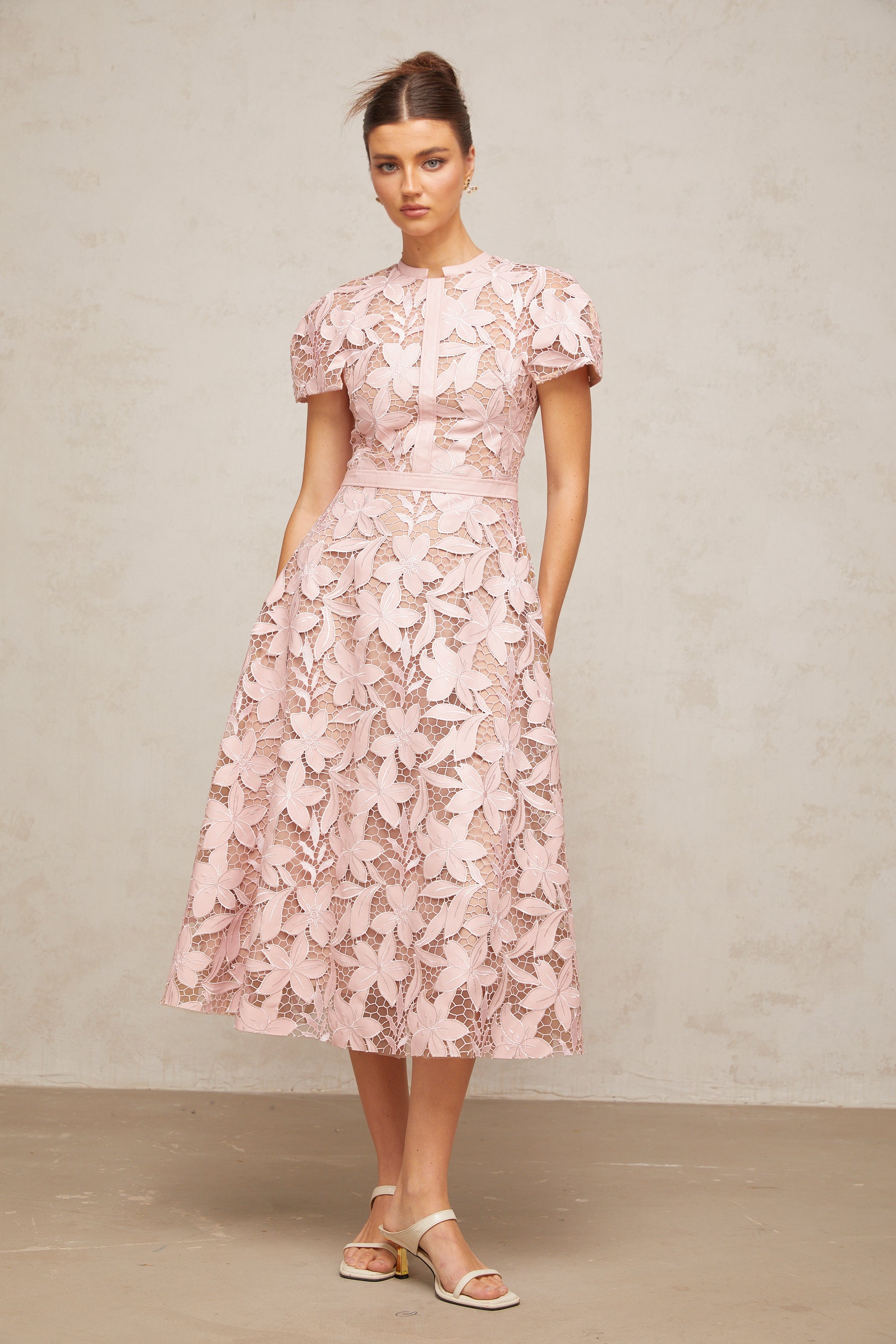 Pink floral laser-cut midi dress with short sleeves and a high neckline
