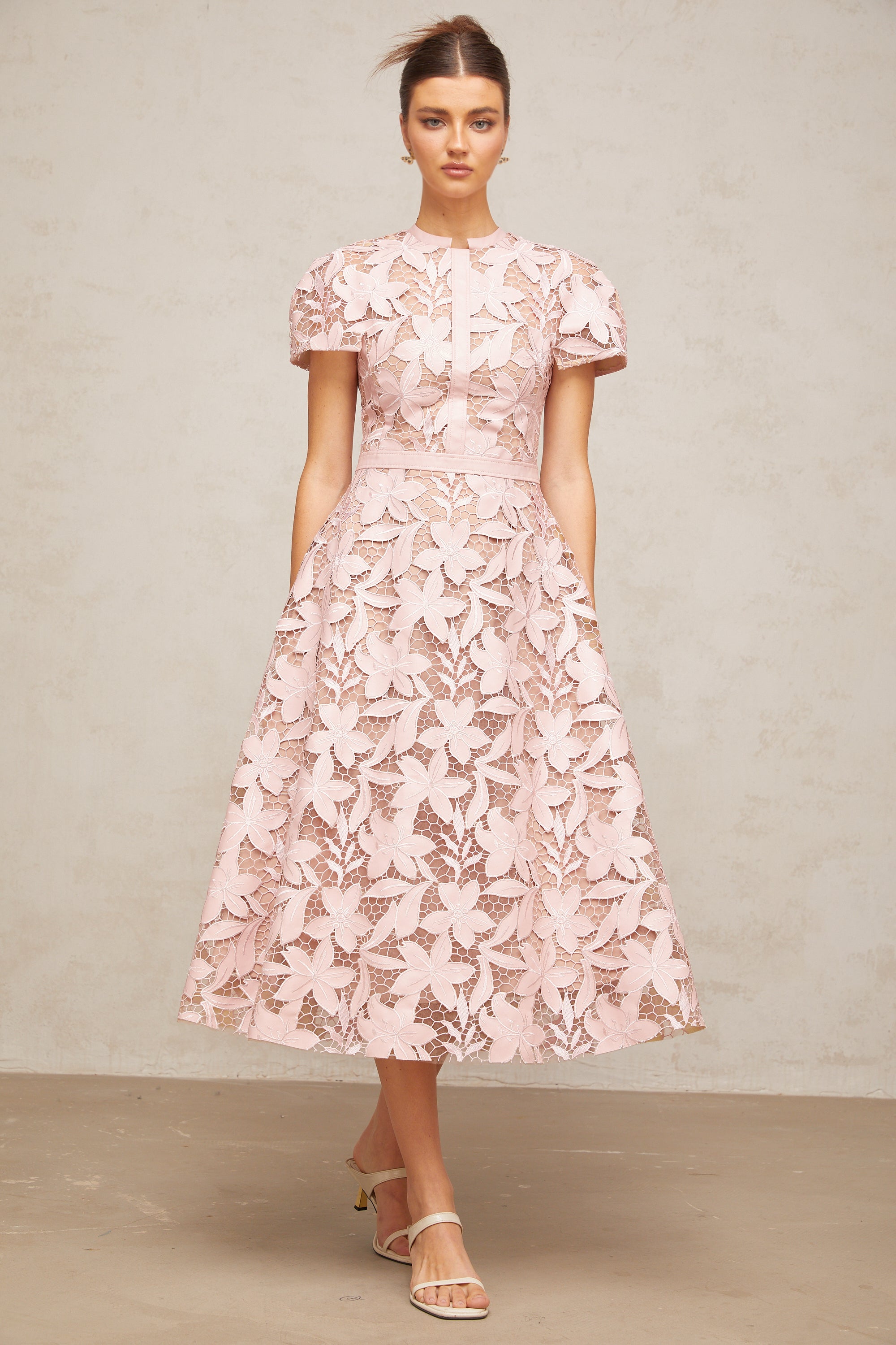 Pink floral laser-cut midi dress with short sleeves and a high neckline
