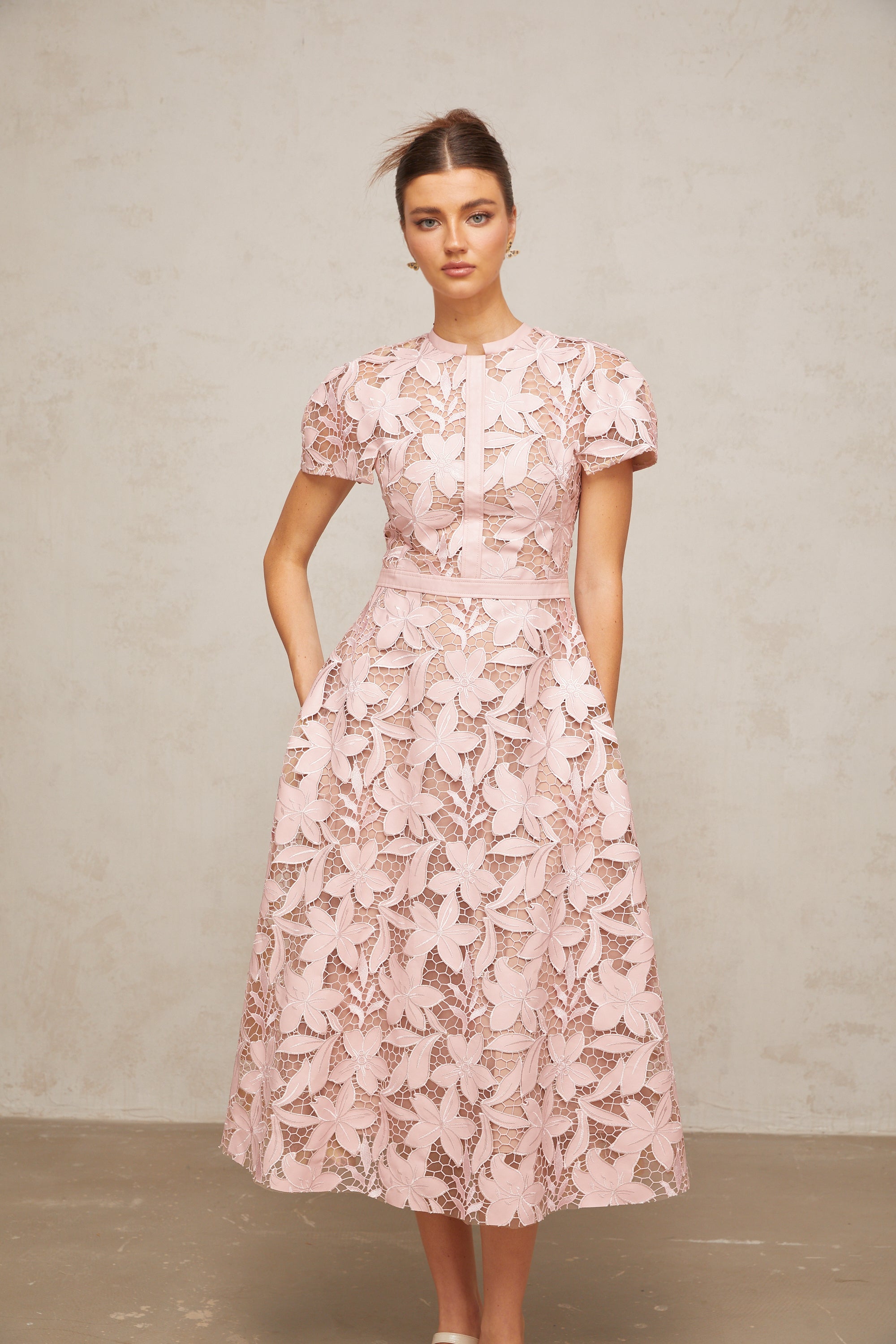 Pink floral laser-cut midi dress with short sleeves and a high neckline