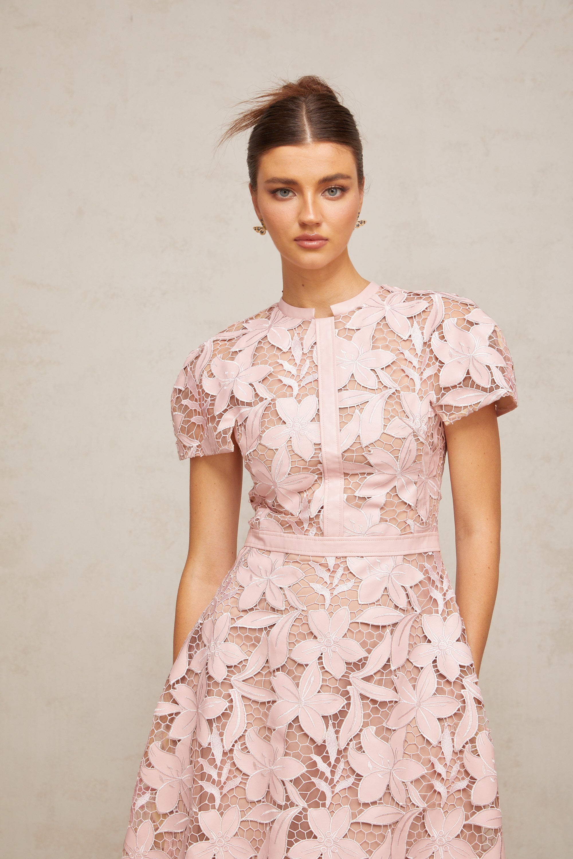 Pink floral laser-cut midi dress with short sleeves and a high neckline