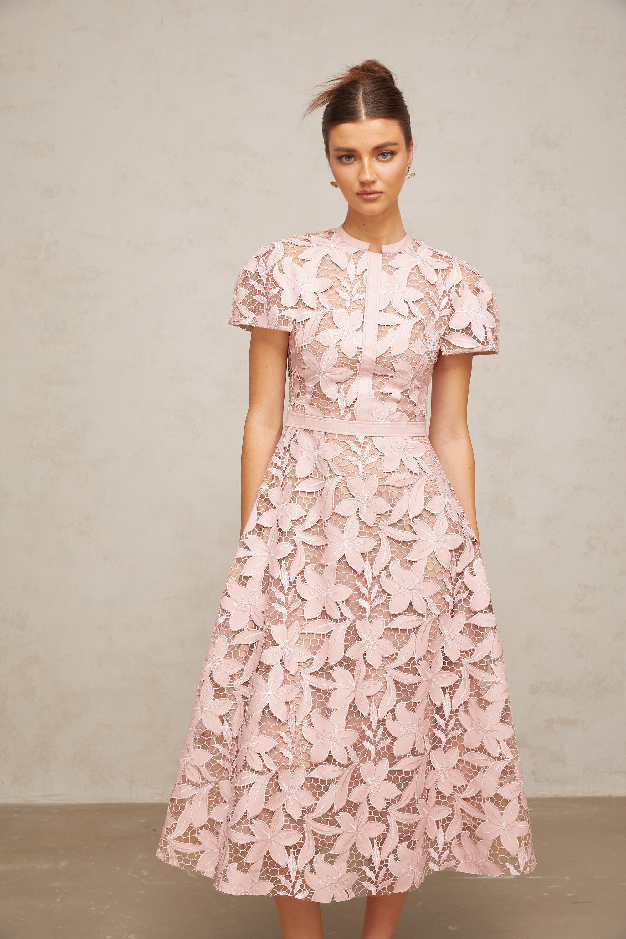 Pink floral laser-cut midi dress with short sleeves and a high neckline