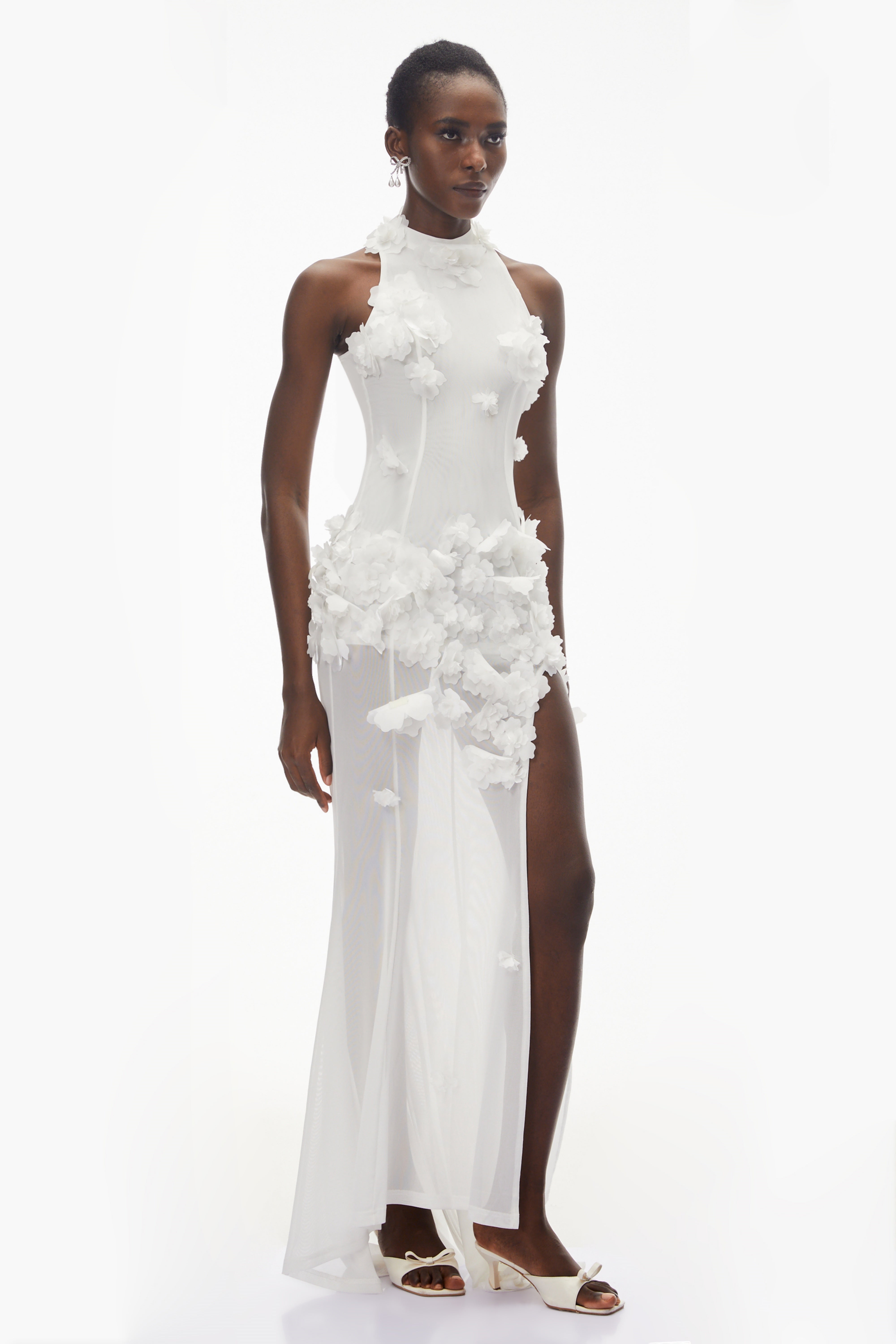 White halter-neck maxi gown with 3D floral appliqué