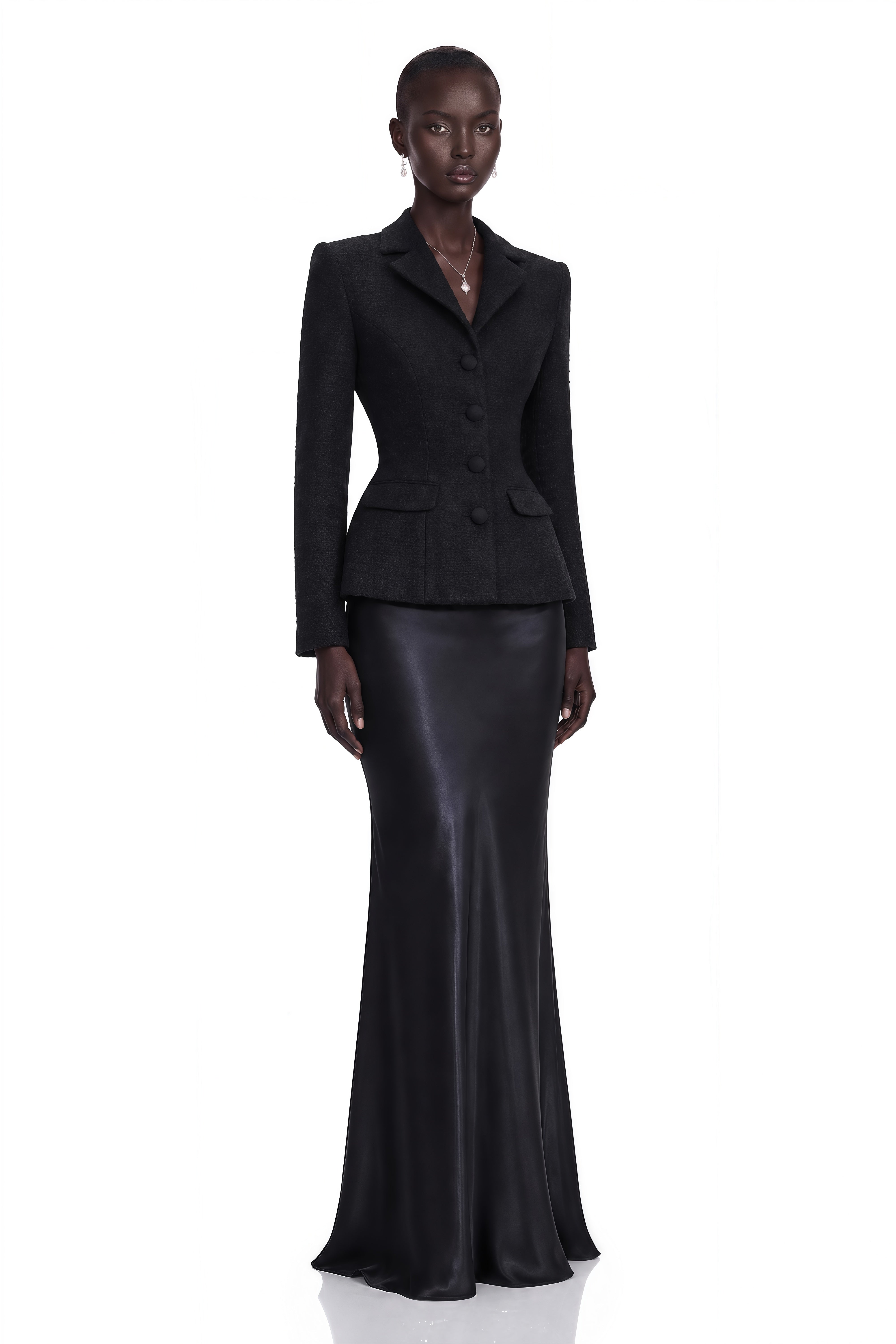 Black blazer paired with a black satin maxi skirt