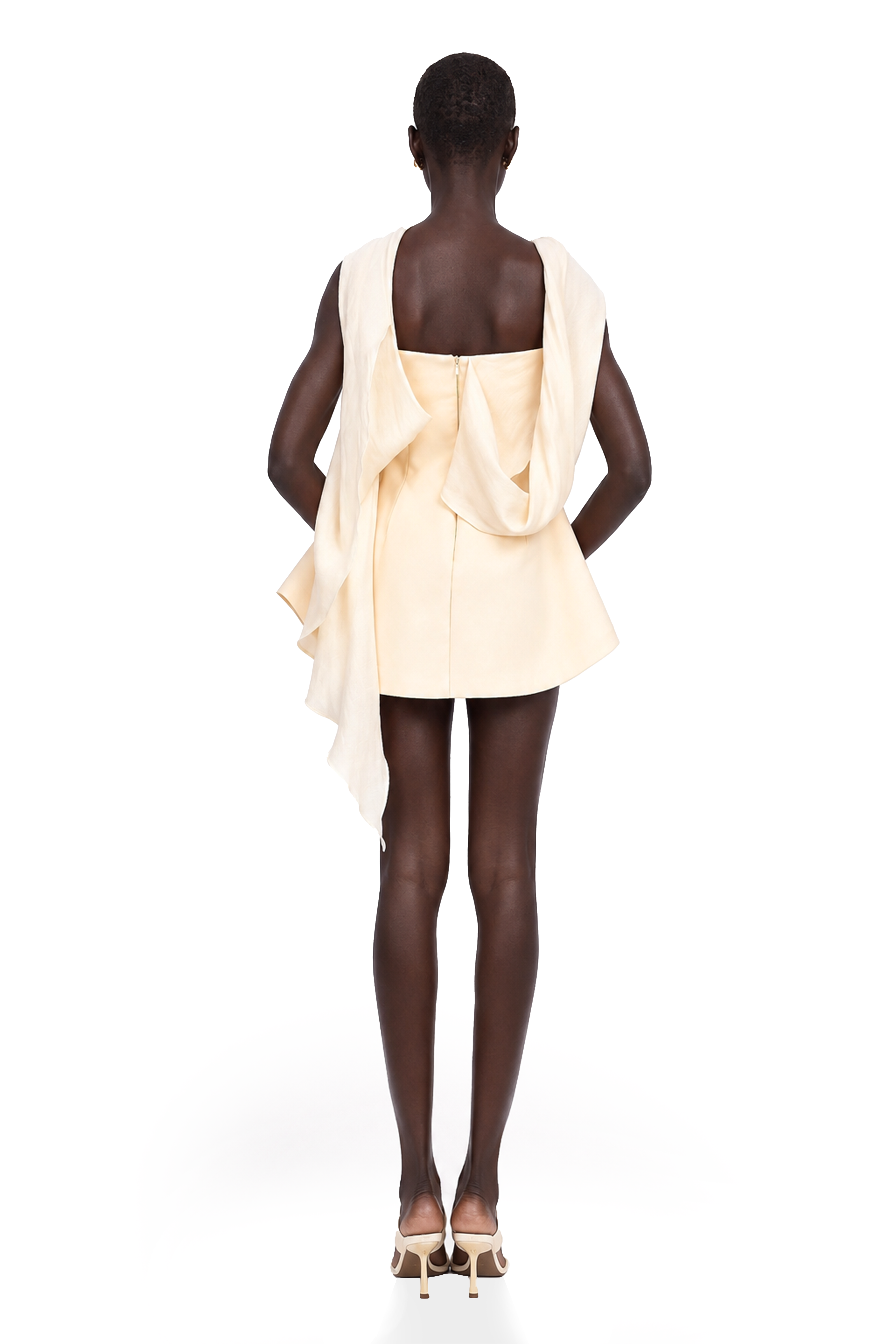 Cream strapless mini dress with a draped cape