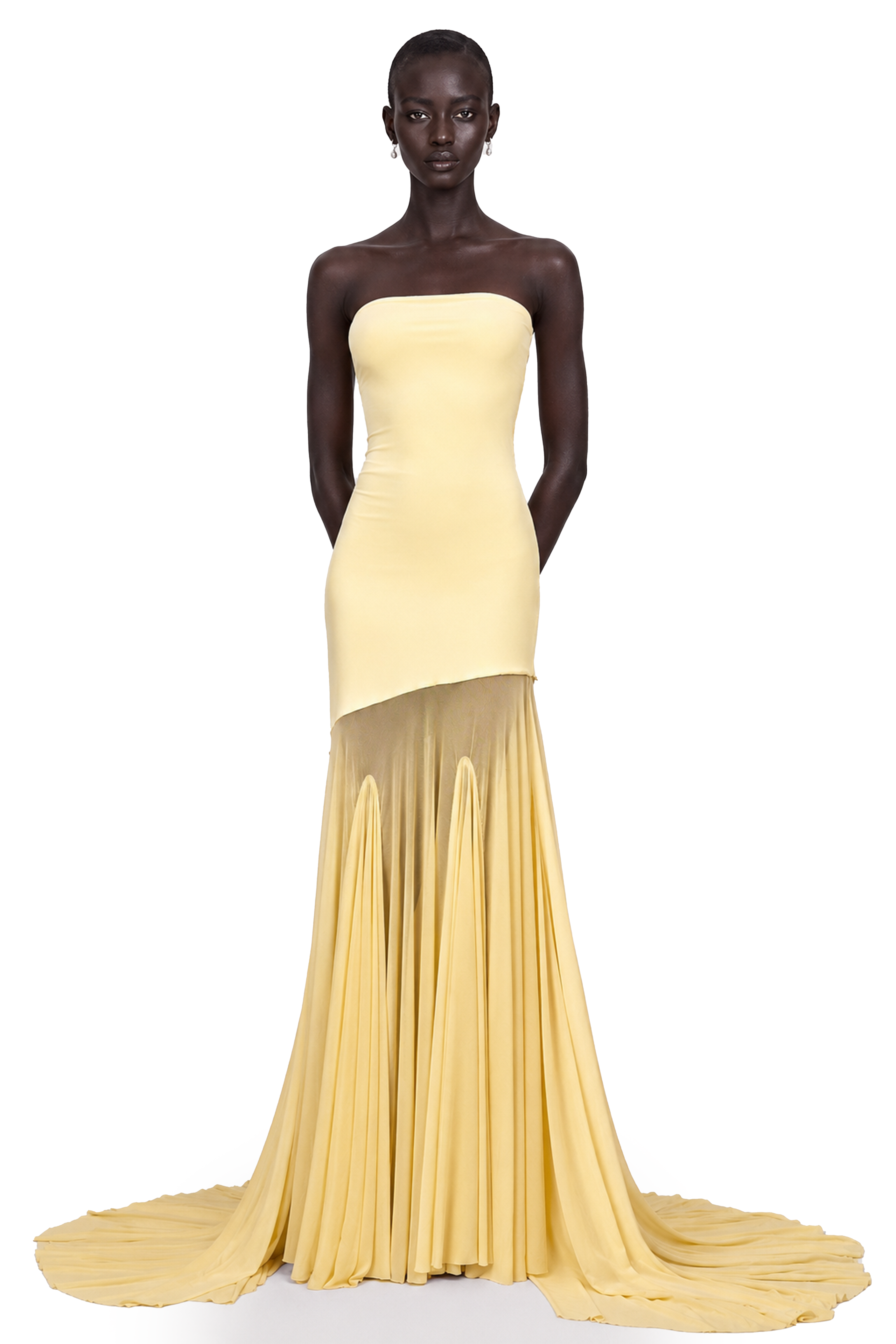 Pale yellow strapless gown with an asymmetrical bodice and pleated sheer skirt
