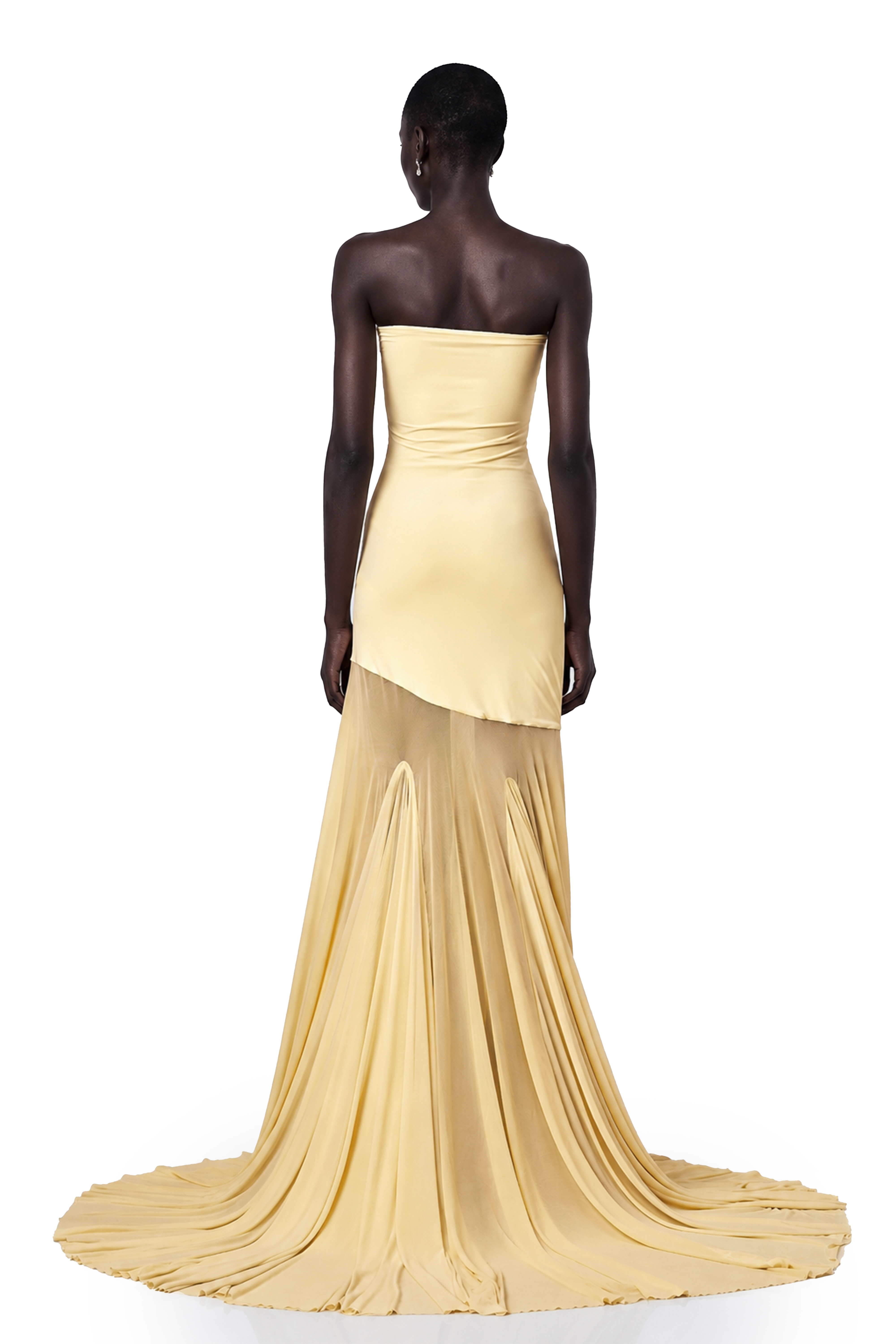 Pale yellow strapless gown with an asymmetrical bodice and pleated sheer skirt