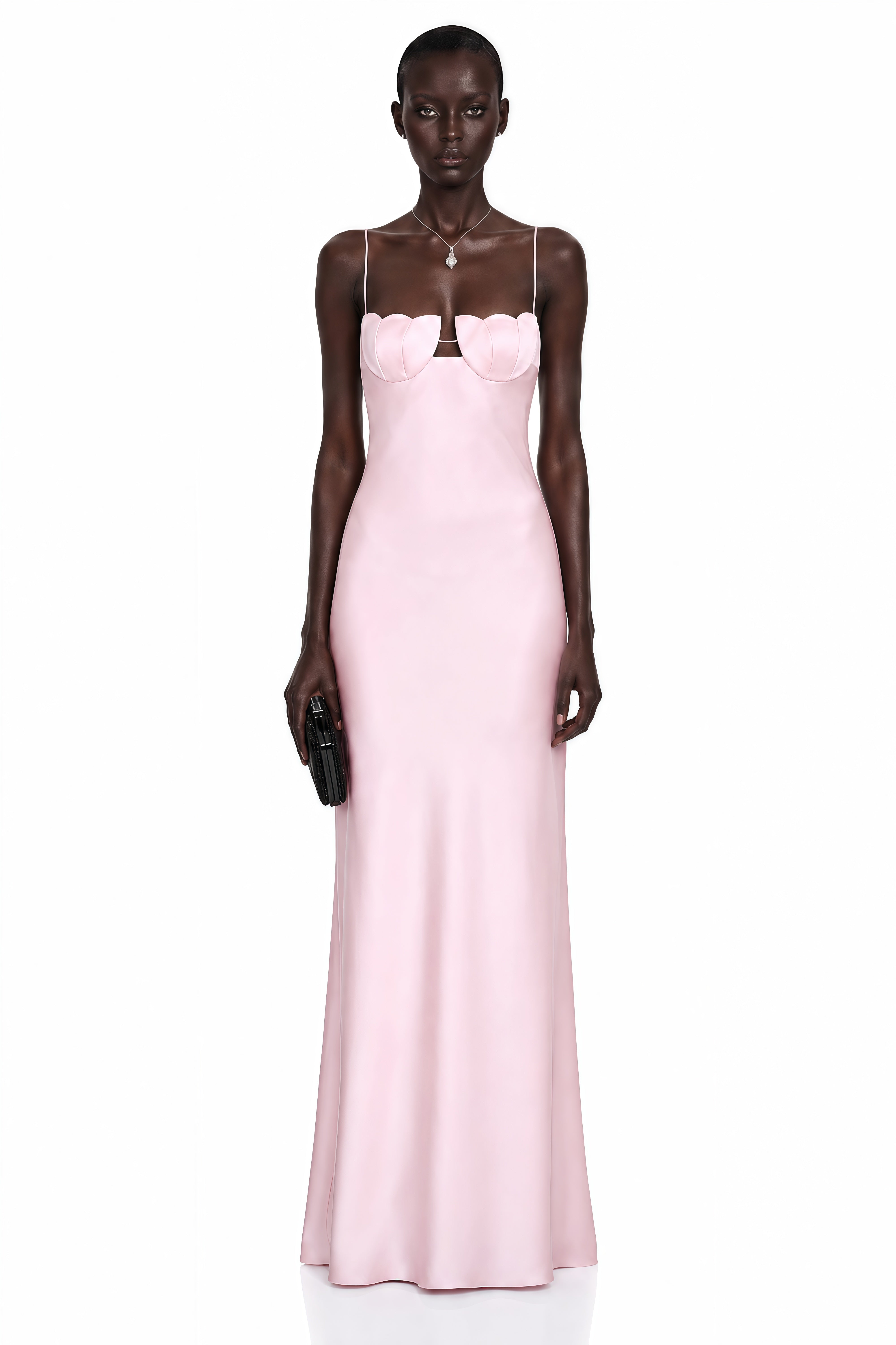 Pink satin slip maxi dress featuring a sculpted seashell-style bustier and thin spaghetti straps
